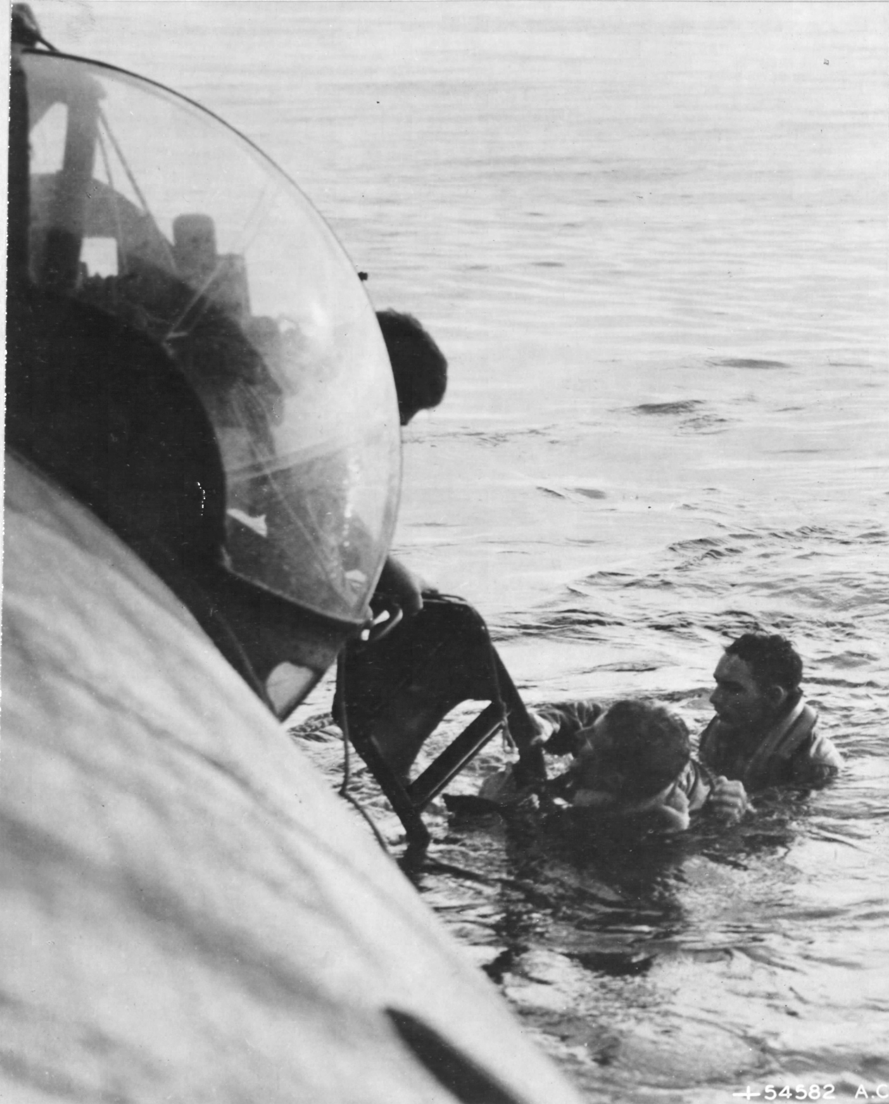 Crew of a PBY Catalina attached to Air-Sea Rescue work to get TSgt James E Latta & SSgt Willis B Morlan out of the Adriatic after they were forced to bail out from their B-24H Liberator following a raid on Vienna, Austria; Oct 13 1944.