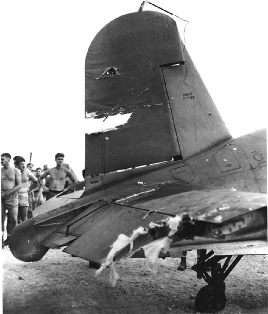 A badly damaged F4U-1A Corsair of Marine Squadron 216 flown by a wounded Lt Robert Marshall managed to return safely to Torokina, Bougainville, Solomons after an encounter with a swarm of A6M Zeros over Rabaul, New Britain, Dec 19 1943. Photo 3 of 5.