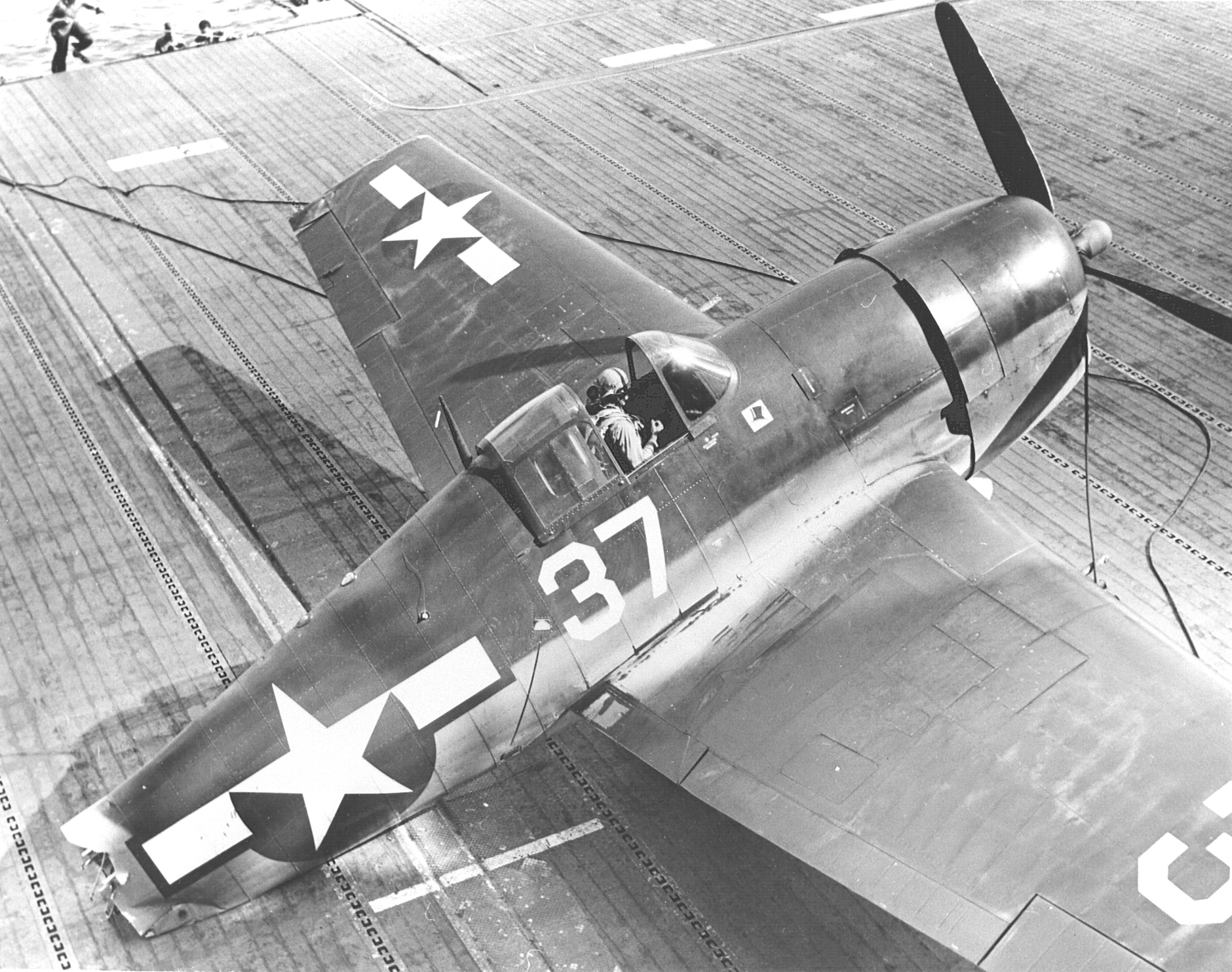 An F6F-3 Hellcat of Fighting Squadron 1, the “High Hatters,” sustains a catastrophic failure while landing aboard the carrier USS Yorktown (Essex-class) north of the Marianas, 16 Jun 1944.