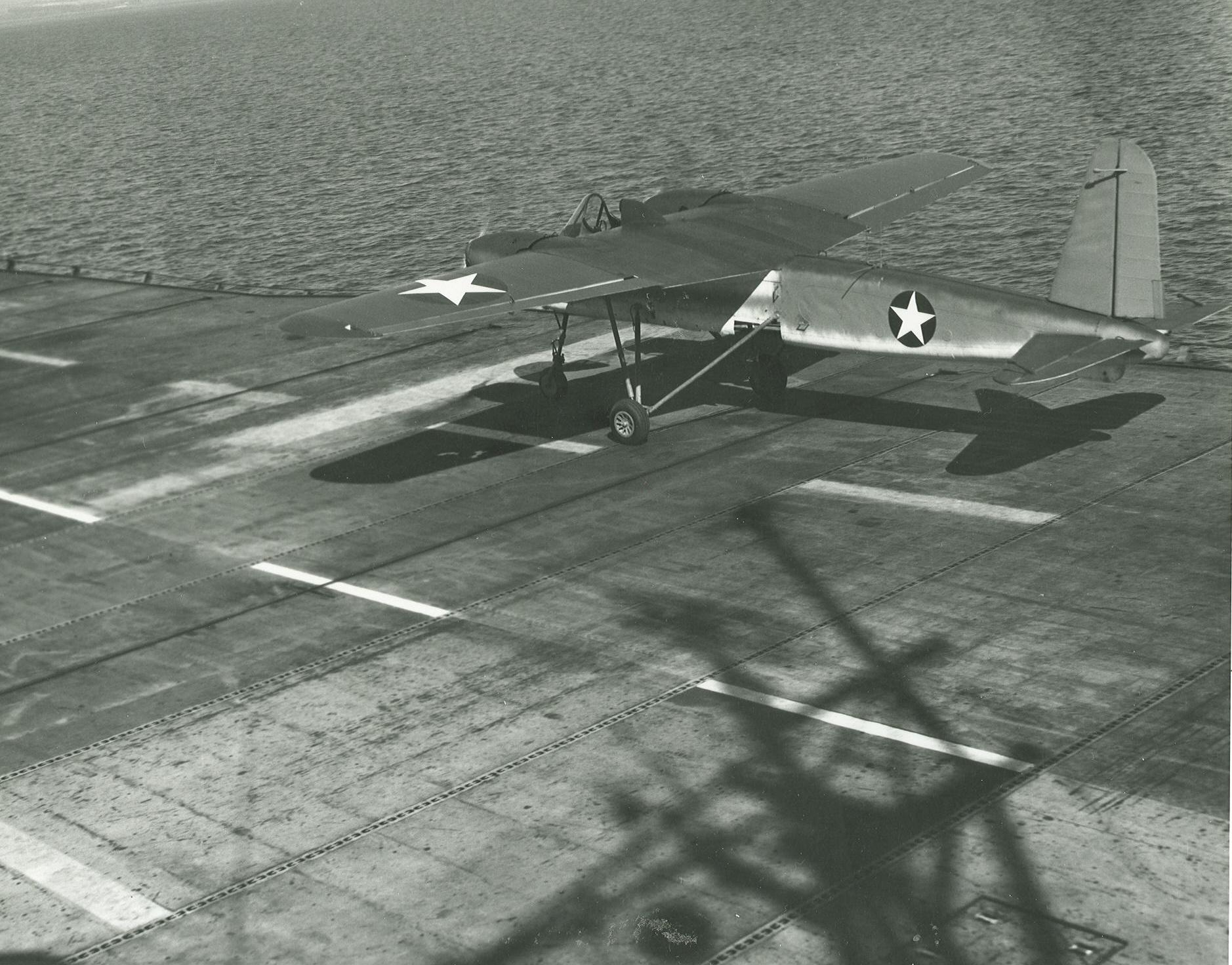 US Navy TDN-1 drone test from the decks of the training carrier USS Sable while steaming in reverse in Grand Traverse Bay, Michigan, United States, 10 Aug 1943. This particular test was unsuccessful. Photo 2 of 4.