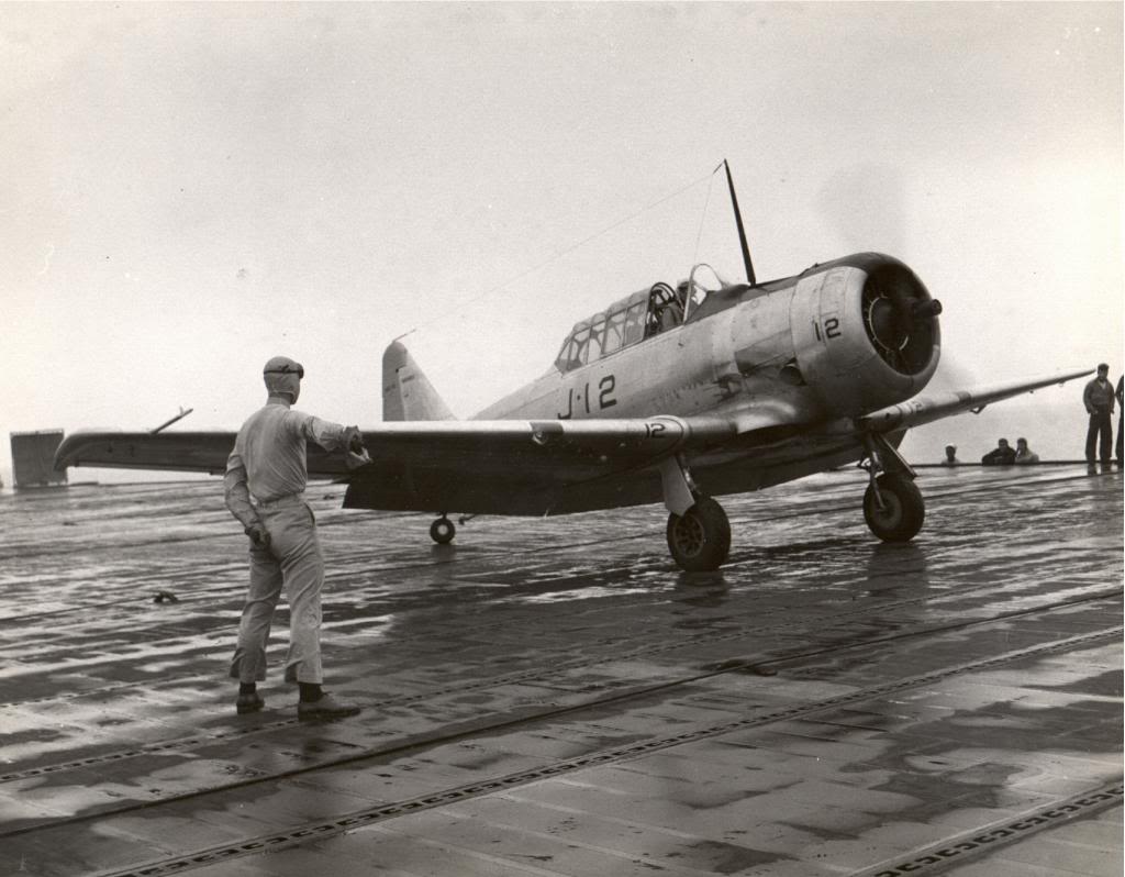 An SNJ Texan readies for launch from the training aircraft carrier USS Sable on Lake Michigan, United States, 1945.