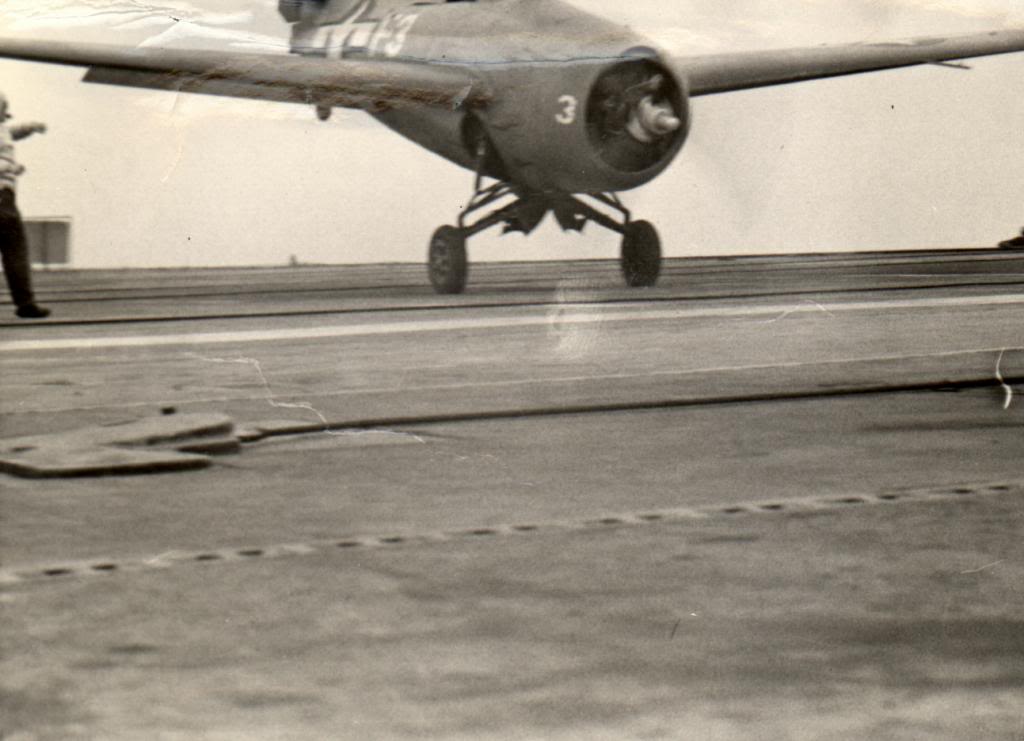 The camera catches an FM-2 Wildcat mid-bounce in a hard landing aboard the training aircraft carrier USS Sable on Lake Michigan, United States, 1943.  This aircraft probably ended up on its back, like so many did.