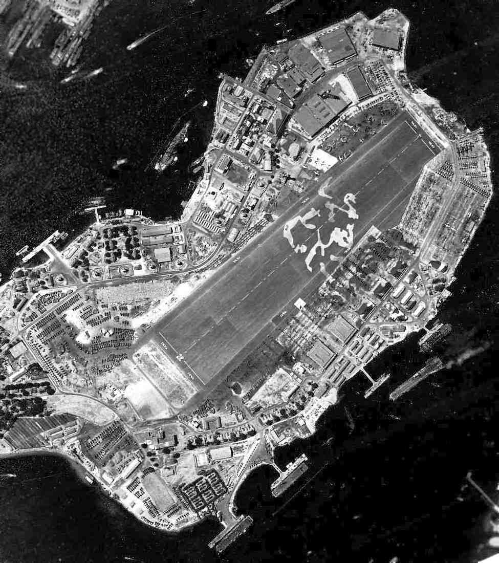 Ford Island Naval Air Station, Pearl Harbor, Hawaii during the build-up before the Leyte Gulf landings with over 1,000 aircraft visible on the islands with more arriving on transport carriers, Sep 5, 1944.