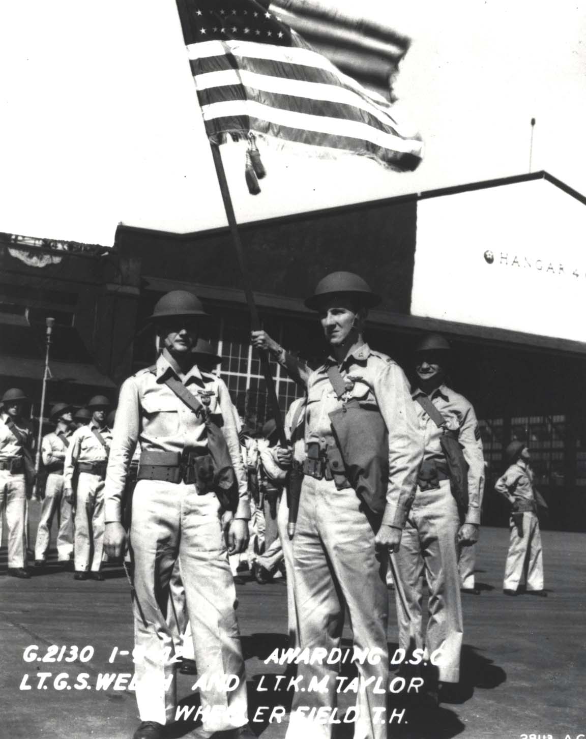 Lt George Welch and Lt Ken Taylor pose for a photograph after the ceremony at Wheeler Field, Hawaii, Jan 9, 1942 where each was presented with the Distinguished Service Cross for their actions on Dec 7, 1941.