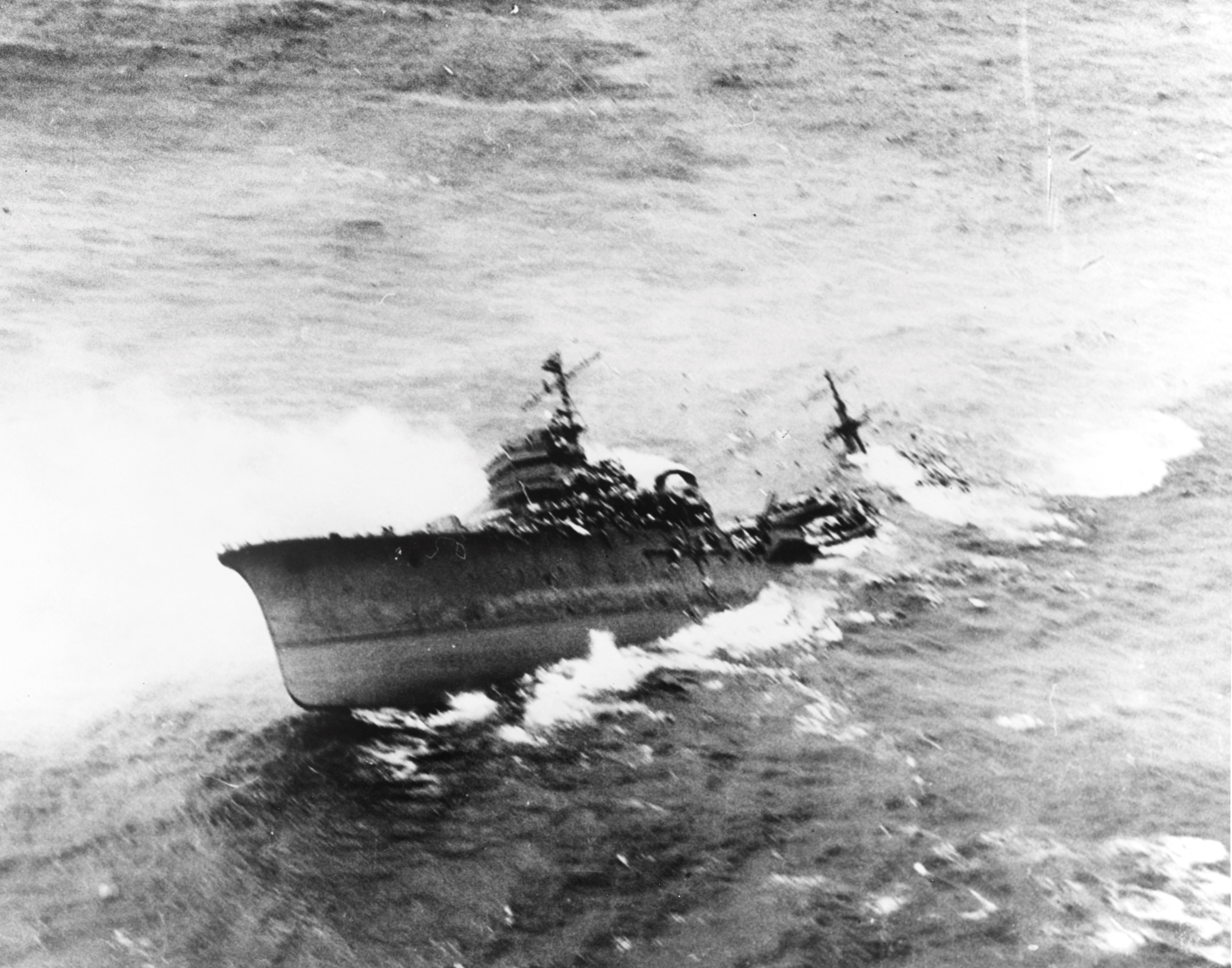 Japanese cruiser Kashii sinking by the stern after being attacked by United States carrier aircraft off the coast of French Indochina (Vietnam) north of Qui Nhon, Jan 12, 1945. Photo 4 of 9