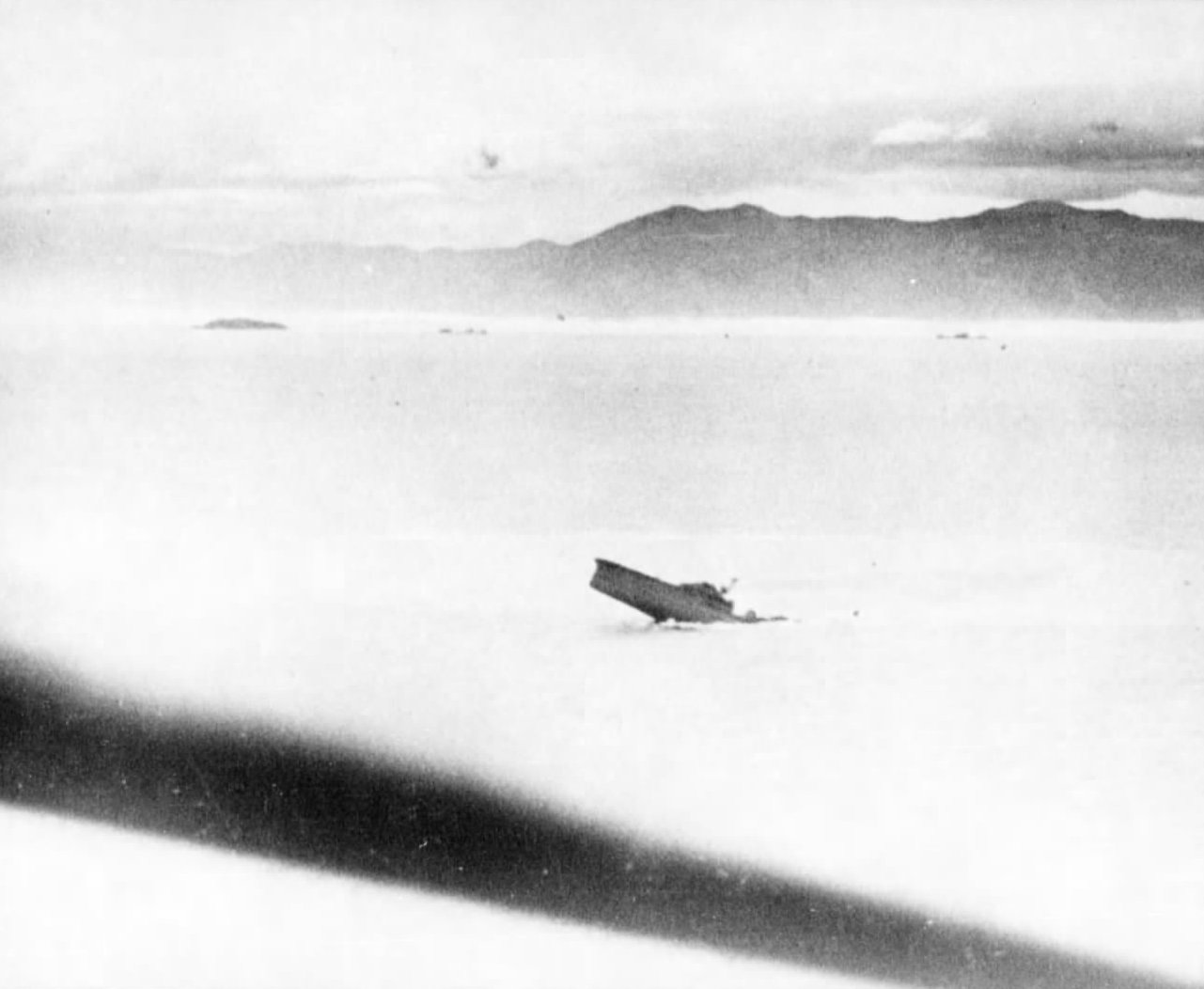Japanese cruiser Kashii sinking by the stern after being attacked by United States carrier aircraft off the coast of French Indochina (Vietnam) north of Qui Nhon, Jan 12, 1945. Photo 6 of 9