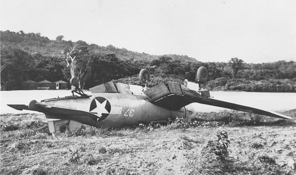 Crashed F4U-1 Corsair of Marine Squadron VMF-123 or VMF-124, mid-1943, probably at Henderson Field, Guadalcanal