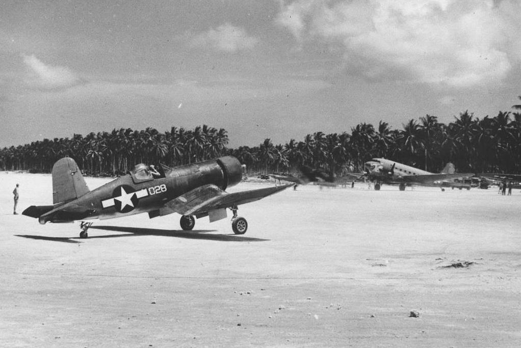 F4U-1A Corsair of Marine Squadron VMF-223 at Green Island (now Nissan Island), 1944. Note the R4D Skytrain with nose art, rare on Navy or Marine aircraft.