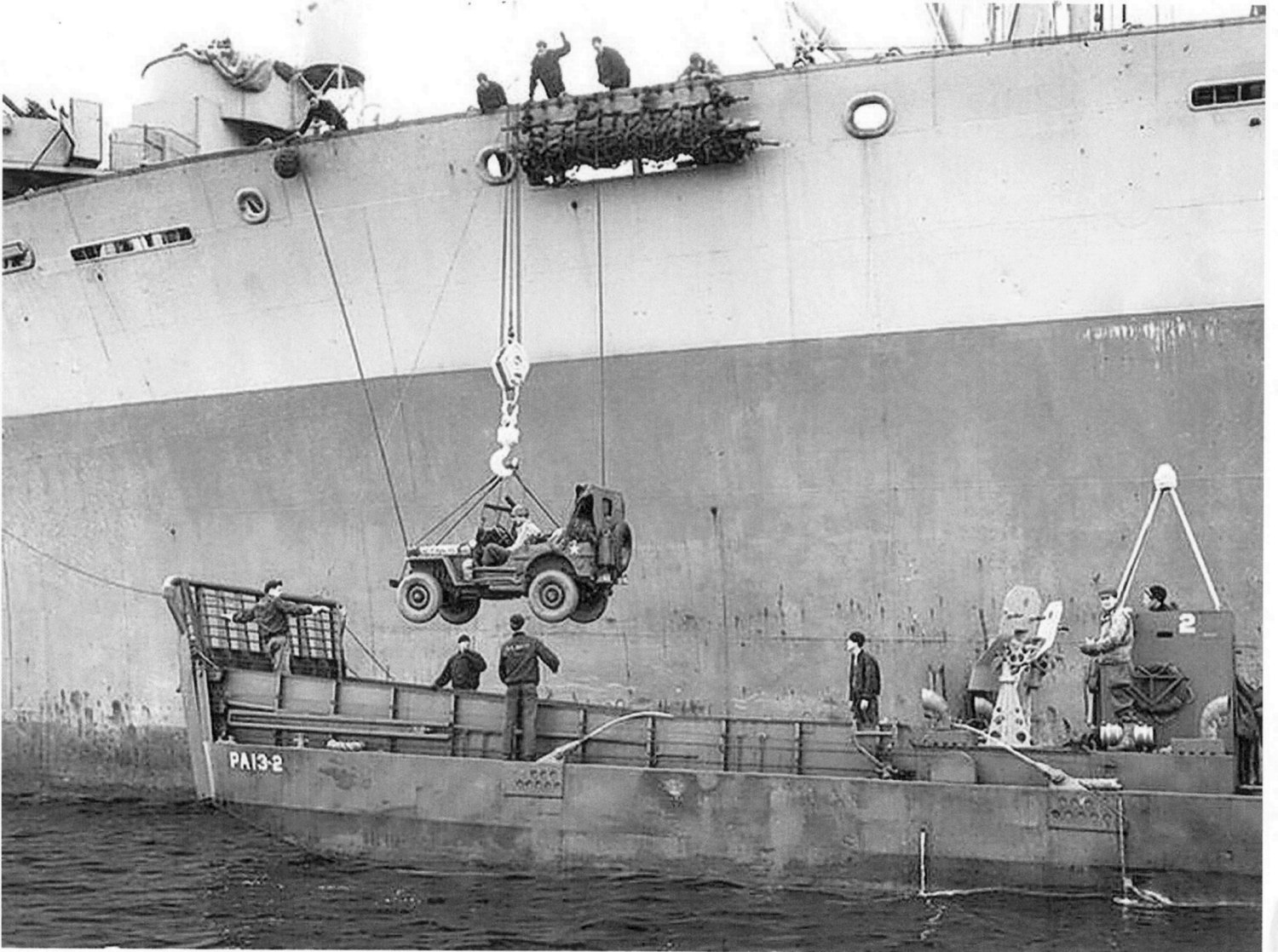 A Jeep being lowered into an LCM from Attack Transport USS Joseph T. Dickman (APA-13 – former SS President Roosevelt), manned by USCG personnel off Normandy, June 1944. Photo 2 of 2