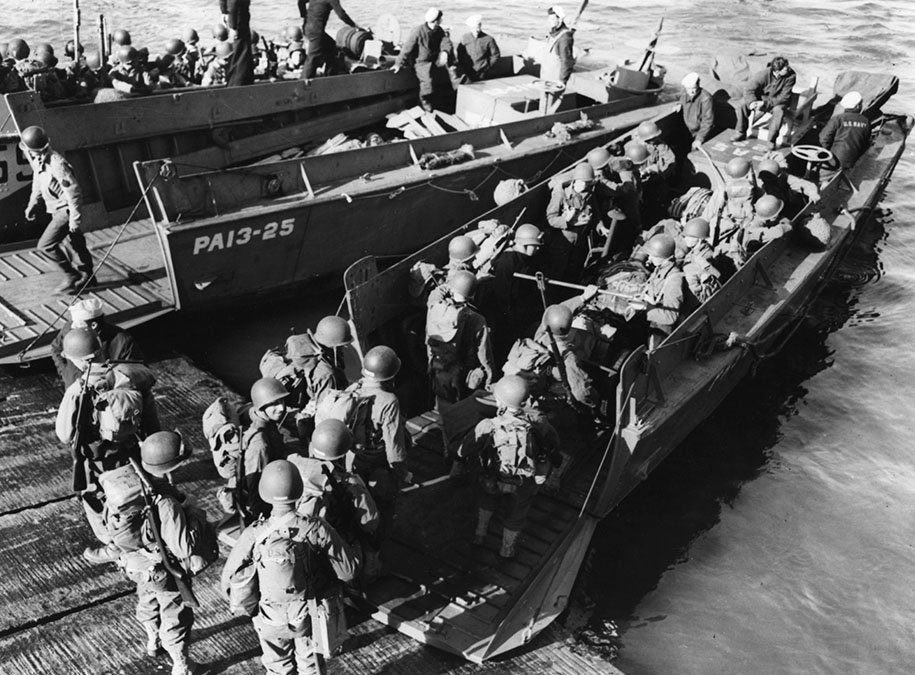 US Army troops board an LVCP landing craft from Amphibious Transport Ship USS Joseph T Dickman at Torquay Hards, England, United Kingdom for a landing exercise in preparation for the Normandy invasion.