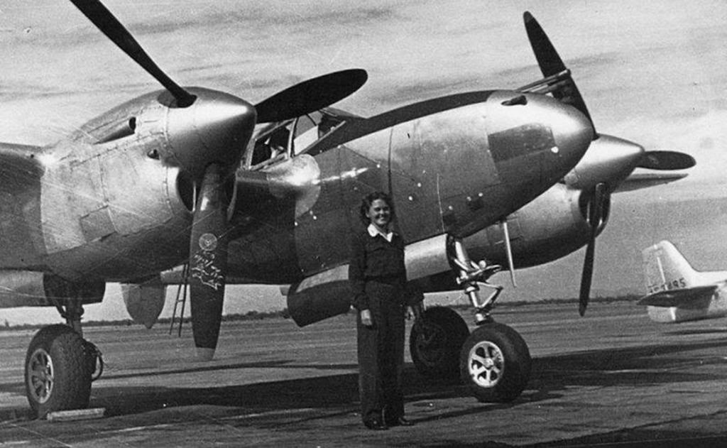 WASP pilot Catherine Vail Bridge standing in front of a P-38 Lightning, date and location unknown.