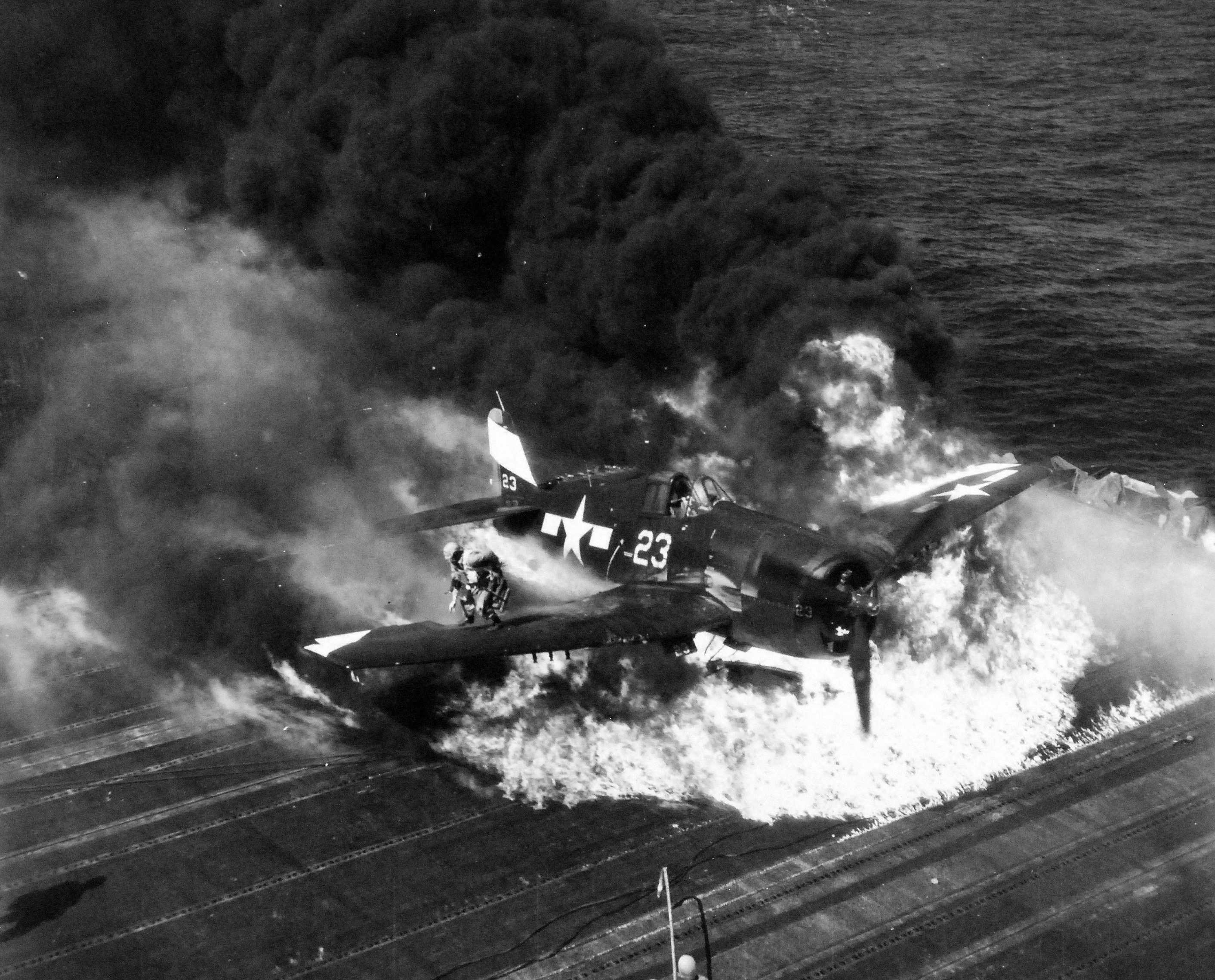 Ensign Ardon R. Ives of Fighting-Bombing Squadron VBF-9 crashed his F6F-5 Hellcat through the barrier on USS Lexington (Essex-class) and ruptured the center-line fuel tank, Feb 1945, western Pacific. Photo 6 of 7