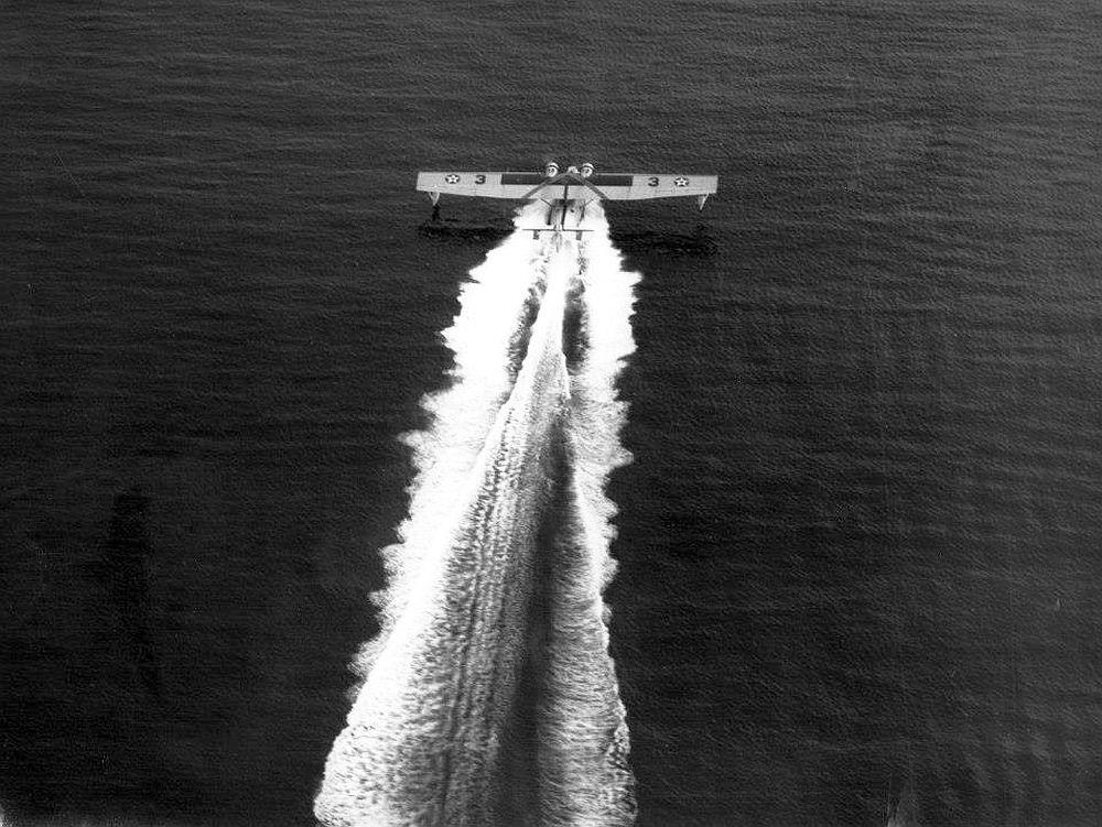 Overhead view of a PBY Catalina on its take-off run, Panama Canal Zone, 1939.