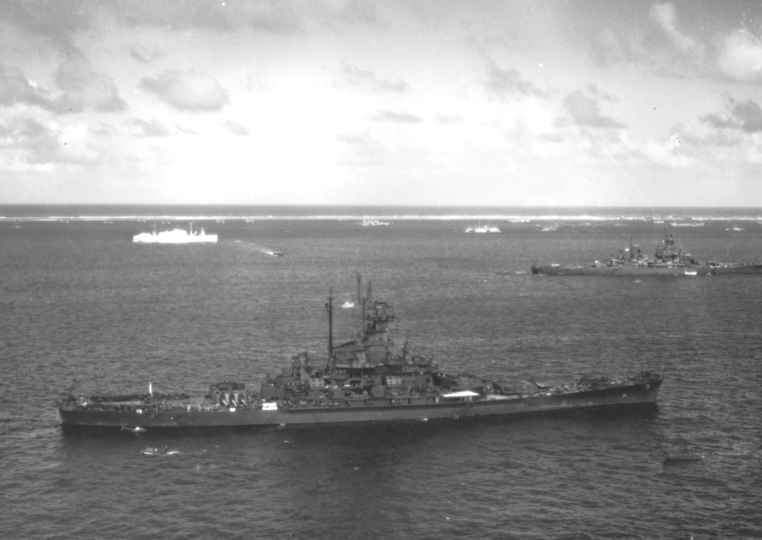 US Battleship South Dakota at anchor at Ulithi Atoll, 8 Dec 1944. Note Hospital Ship Samaritan above left and Battleship New Jersey at right.