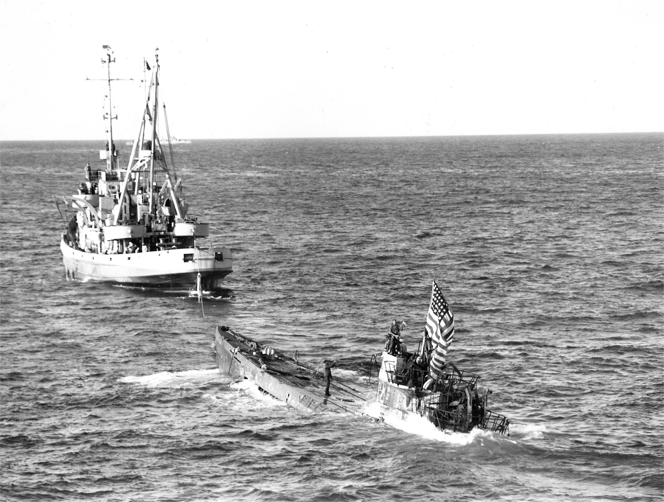 Oceangoing tug USS Abnaki takes the captured Type IXC submarine U-505 under tow, 7 Jun 1944. U-505 was captured three days earlier by the USS Guadalcanal hunter group. Photo 1 of 3.