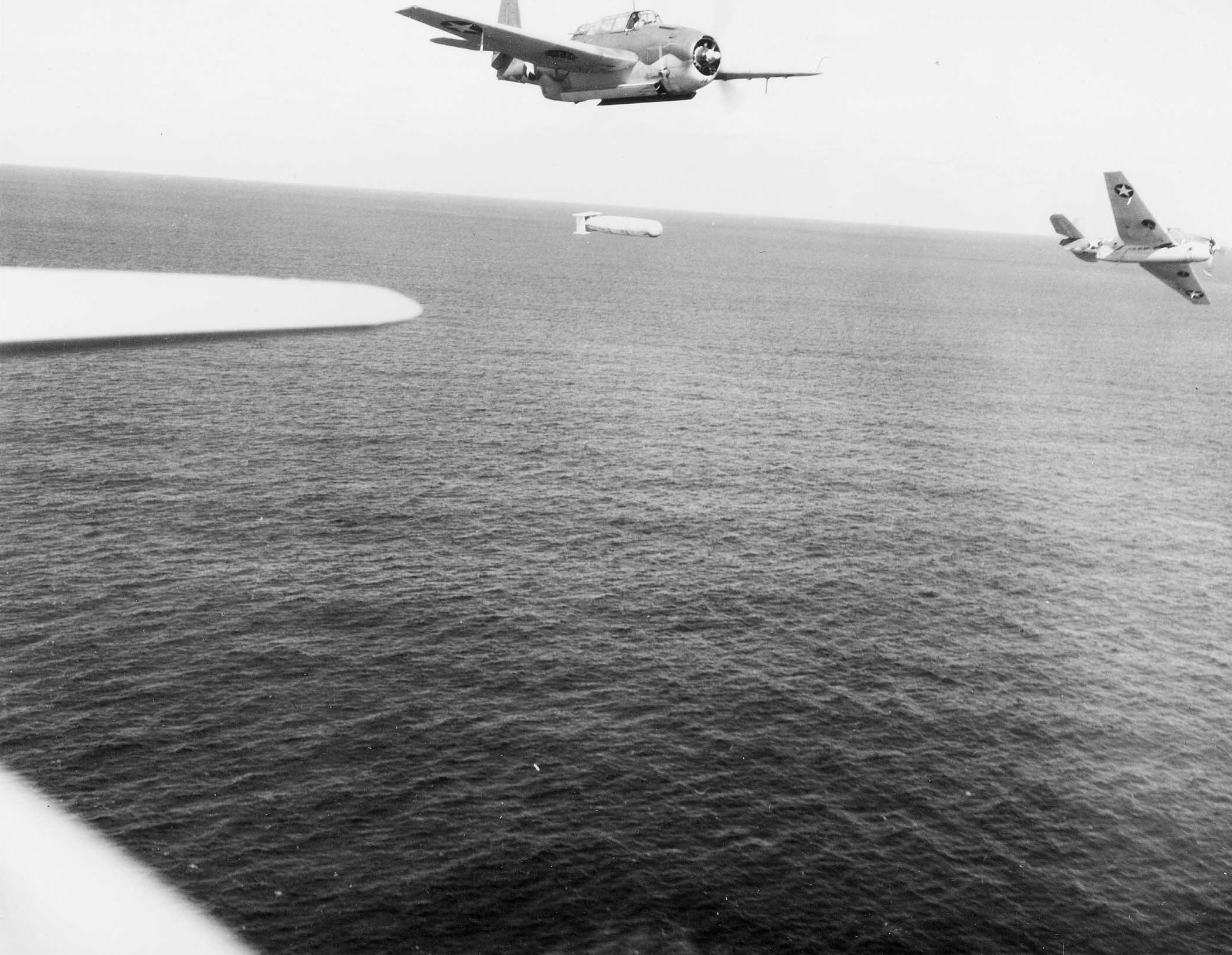 A training flight of TBF-1 Avengers lining up to drop practice torpedoes, late 1942, off the east coast of the United States. Photo 2 of 4.