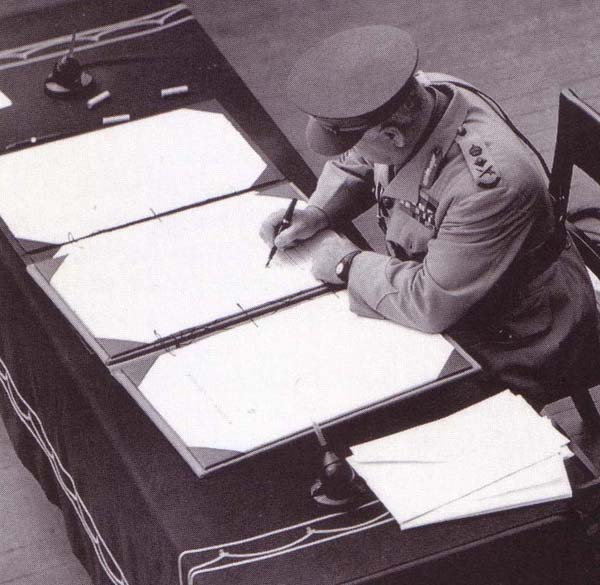 General Sir Thomas Blamey signing the Japanese surrender document on behalf of Australia aboard USS Missouri, 2 Sep 1945.