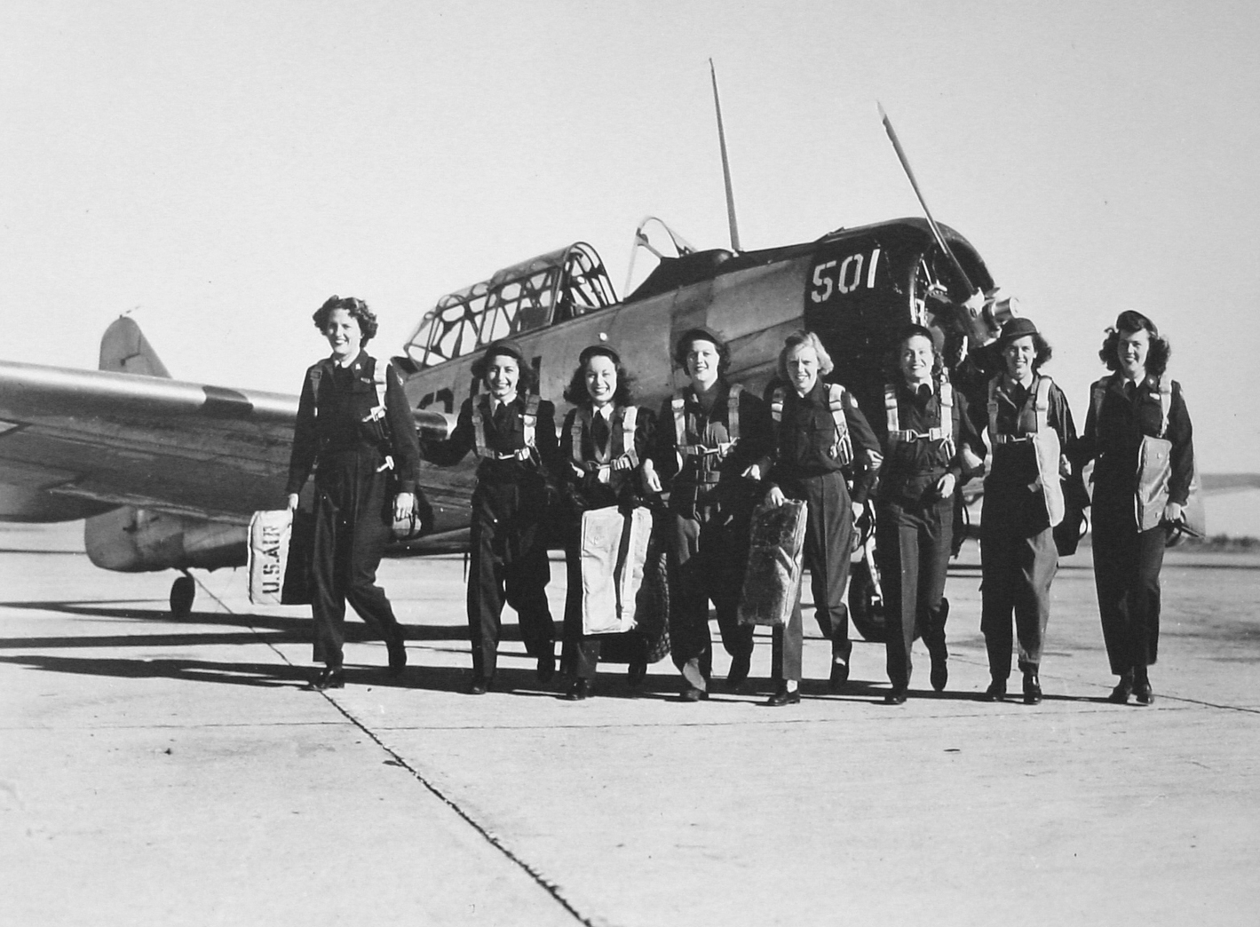 Eight WASP pilots in front of a North American AT-6 Texan 3 days before the WASPs were disbanded, Waco Army Airfield, Texas, United States, Nov 27, 1944. Photo 2 of 2.