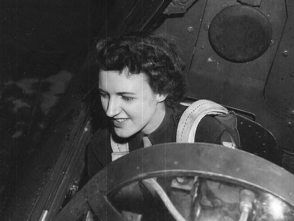 WASP pilot Lillian Yonally seated in the cockpit of an A-25A Shrike at Camp Irwin airstrip, California, United States, 1944