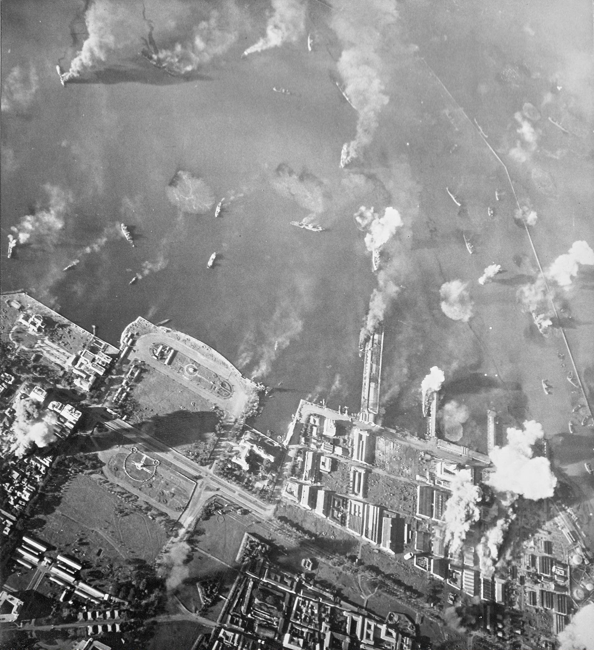 Strike photo of the Manila docks at the height of the attack, 14 Nov 1944, Manila, Luzon, Philippines. Photo taken by aircraft from USS Essex.