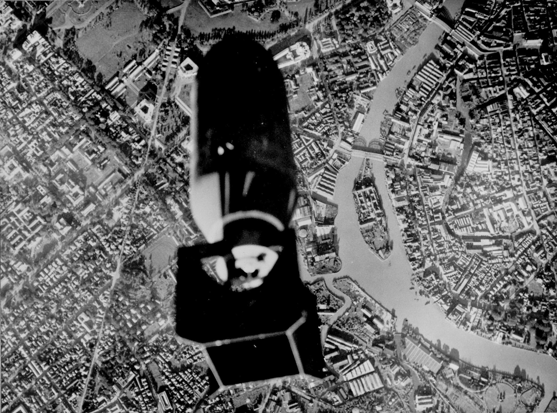 Bomb bay camera in a TBF-1 Avenger from USS Essex captures the moment of bomb release over the Pasig River in downtown Manila, Luzon, Philippines, 14 Nov 1944. Attack was on the dock area 2,000 yards further ahead.