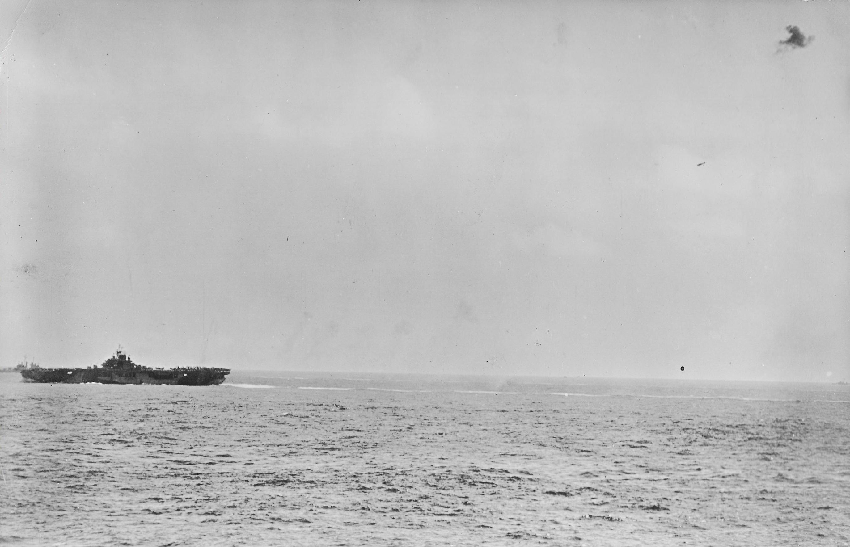 USS Essex struck by Lt. Yoshinori Yamaguchi's special attack D4Y3 Model 33 aircraft, at 1256 hours on 25 Nov 1944, photo 01 of 10
