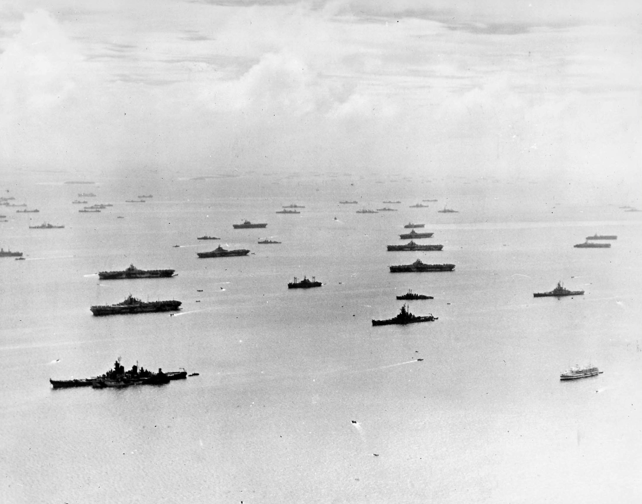 Ships of the US fleet at Ulithi Atoll, Caroline Islands, 8 Feb 1945. Visible are 7 large carriers, 3 light carriers, 3 battleships, and numerous cruisers, destroyers, and support vessels including 1 hospital ship.