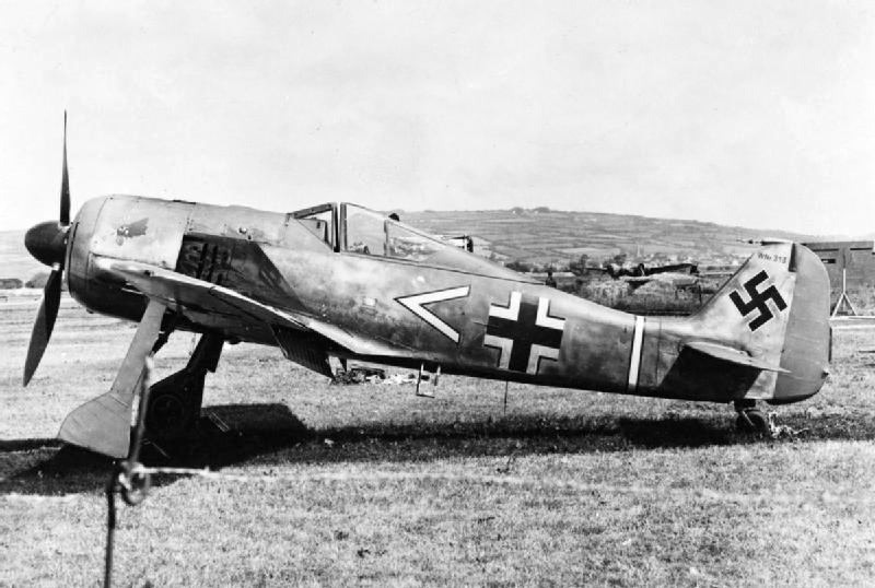 Focke-Wulf Fw 190A-3 at rest at the RAF airfield at Pembrey, South Wales, United Kingdom after German pilot Oberleutnant Armin Faber landed there by mistake after a furious dogfight over Devon, 23 Jun 1942