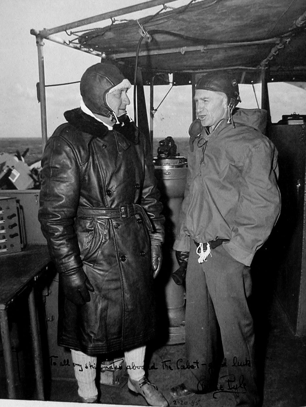 Captain Walton Smith of the Independence-class carrier USS Cabot on the bridge with war correspondent Ernie Pyle off Japan, Feb 1945. Note inscription by Pyle.