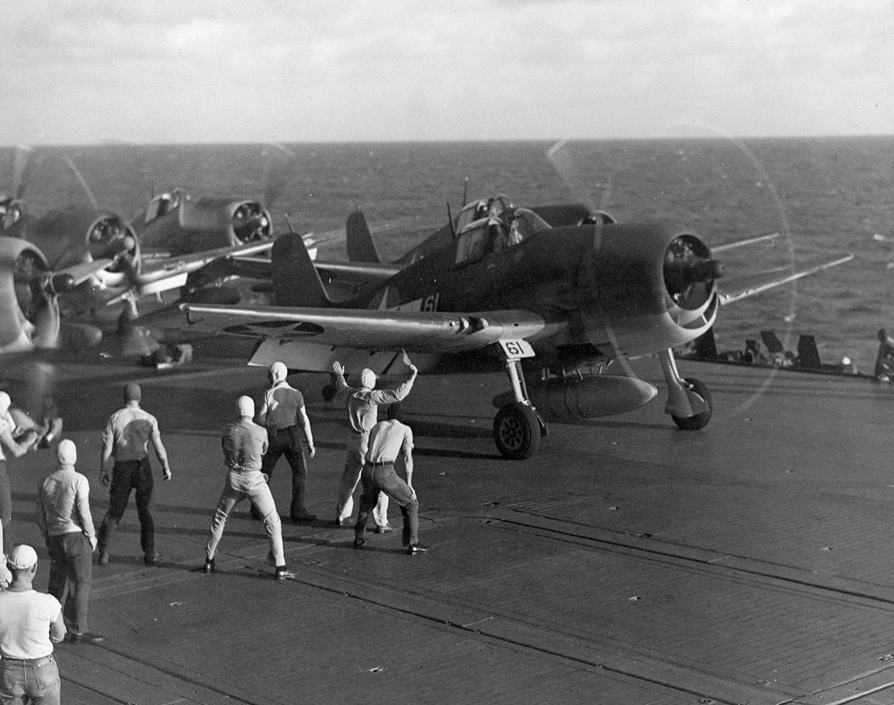 F6F-3 Hellcats preparing for launch from USS Saratoga for strikes against Tarawa, Gilbert Islands, mid Nov 1943.