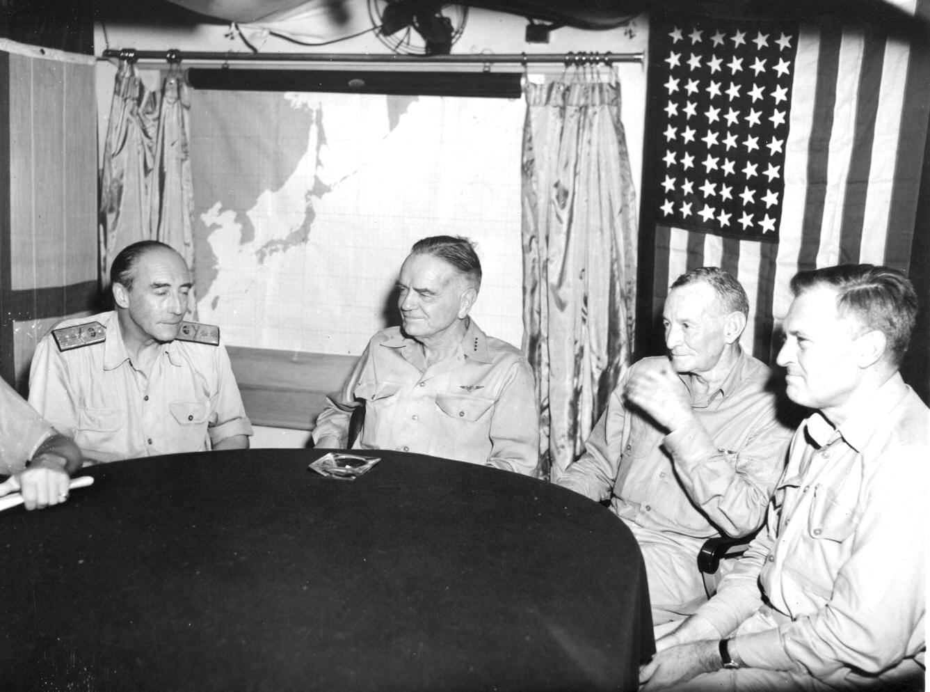 Aboard his flagship, USS Missouri, Admiral William Halsey receives Royal Navy Vice Admiral Sir Bernard Rawlings, Vice Admiral John McCain, and Rear Admiral Wilder Baker to celebrate Japan’s surrender, 22 Aug 1945.