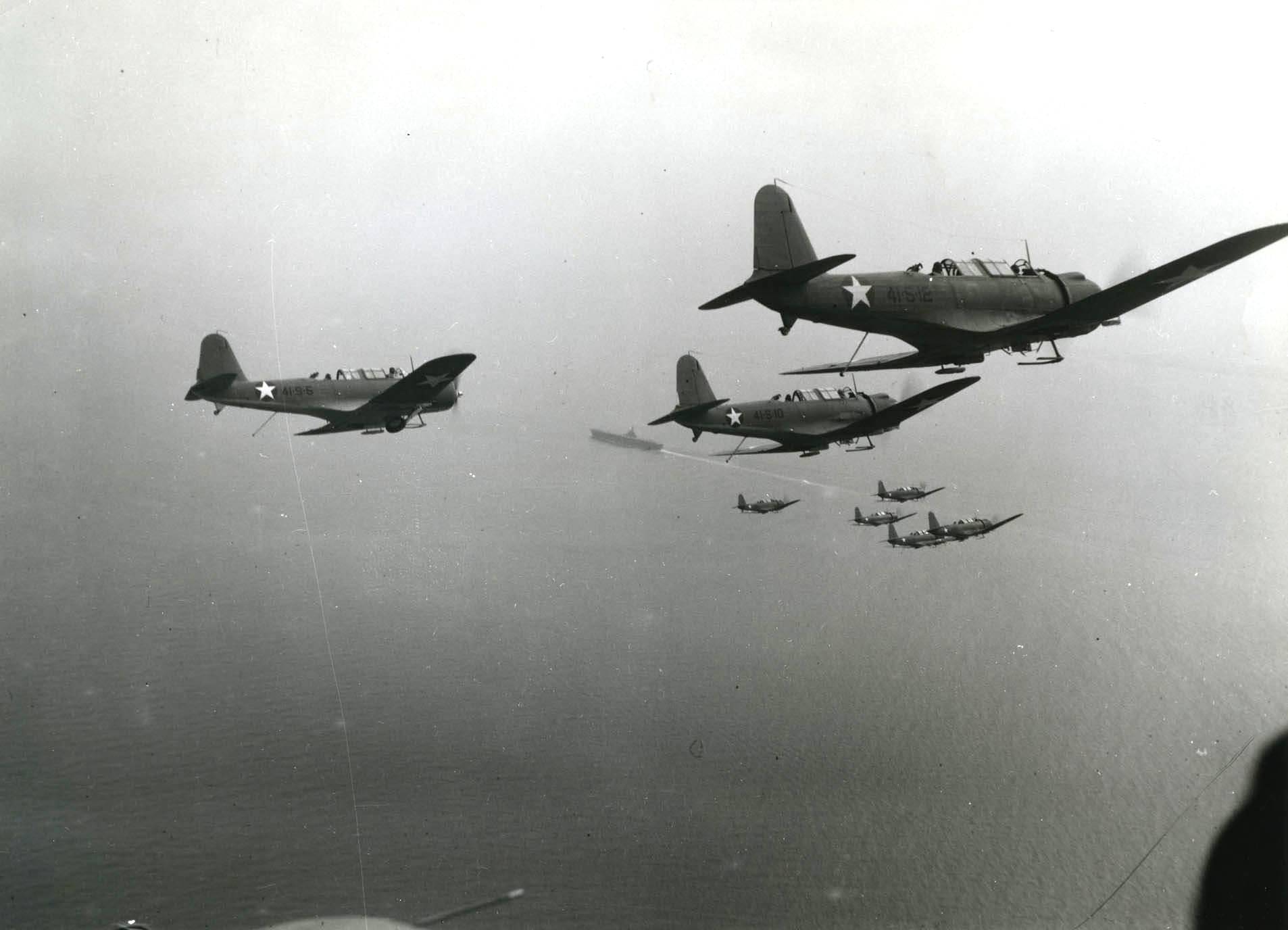 SB2U Vindicator dive bombers of Scouting Squadron VS-41 turning toward the carrier USS Ranger in the Lower Chesapeake Bay, United States, Sep 1942.