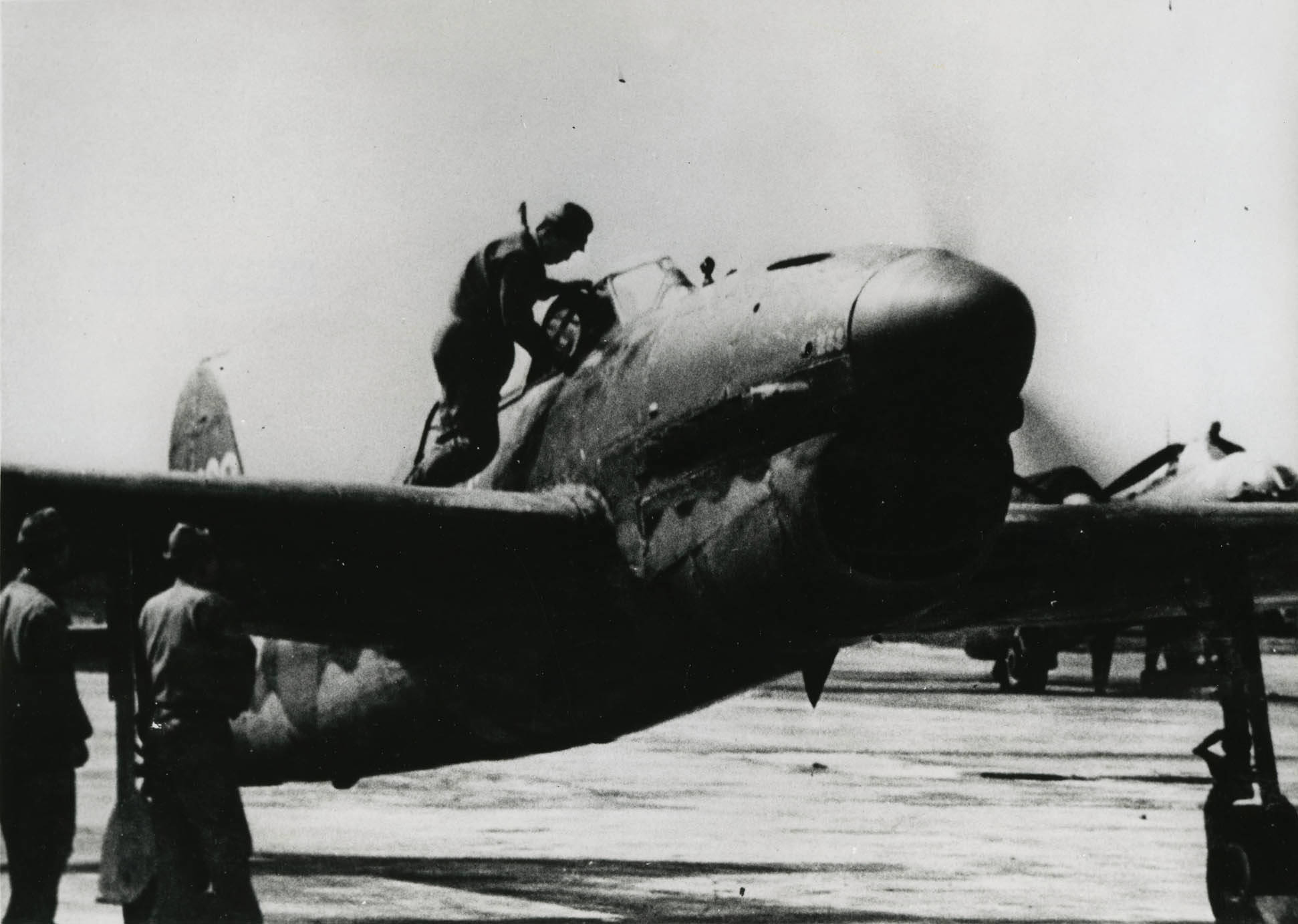 Crews making ready a D4Y-2 Suisei attack bomber, 1943-45, location unknown. The Allied code name for the D4Y was “Judy.”