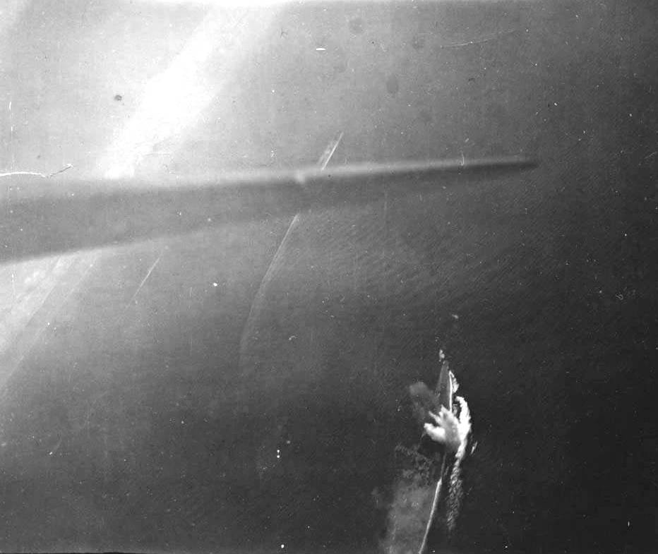 Strike photo taken from planes flying from USS Wasp (Essex-class) showing bombs strikes and near misses on the Japanese battleship Musashi in the Sibuyan Sea, Philippine Islands, 24 Oct 1944