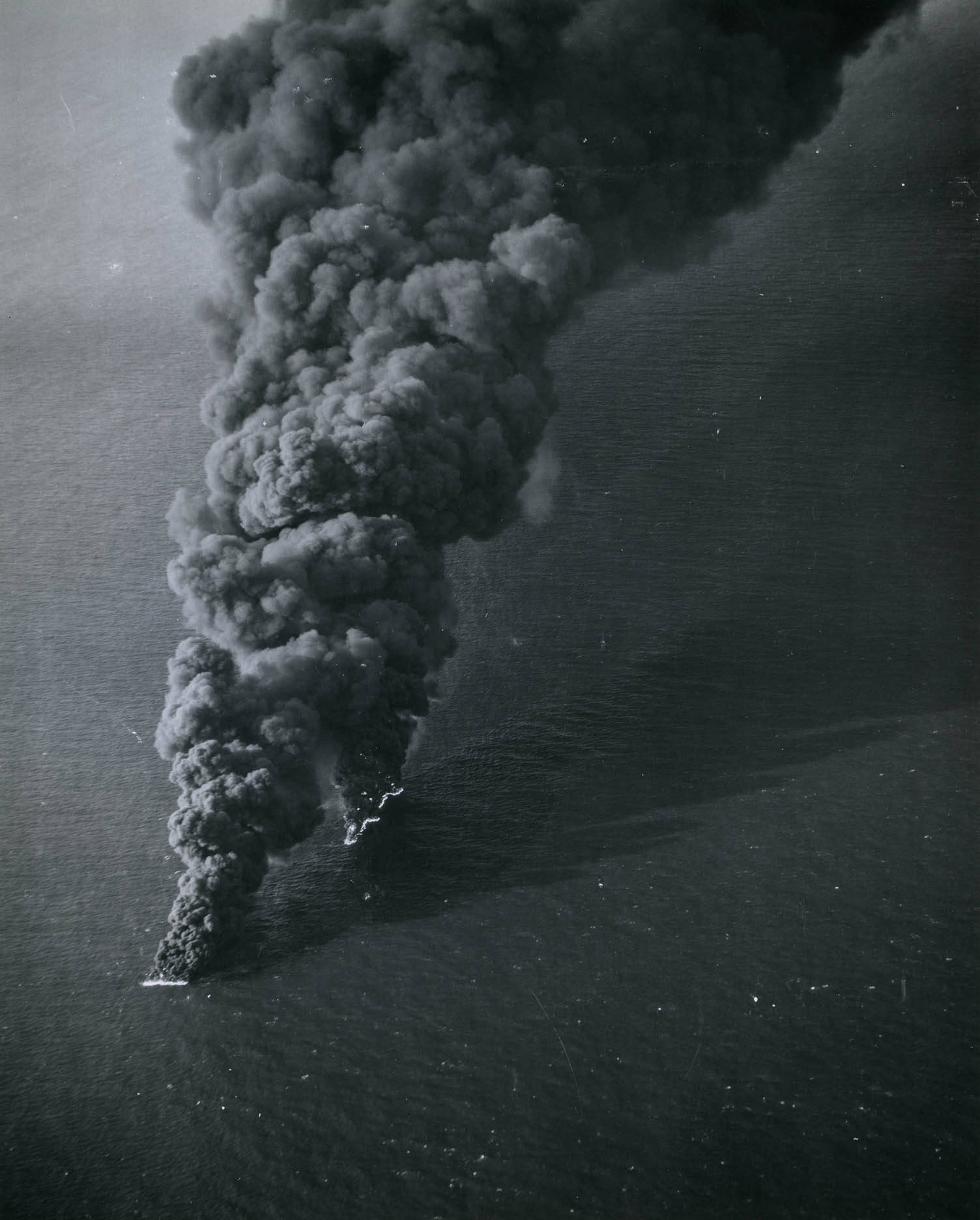 Japanese shipping burning furiously after attacks from US carrier aircraft off the coast of French Indochina (Vietnam), 12 Jan 1945.