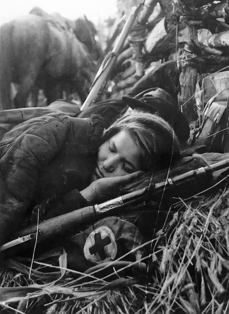 Female Soviet medic resting in the field, date unknown