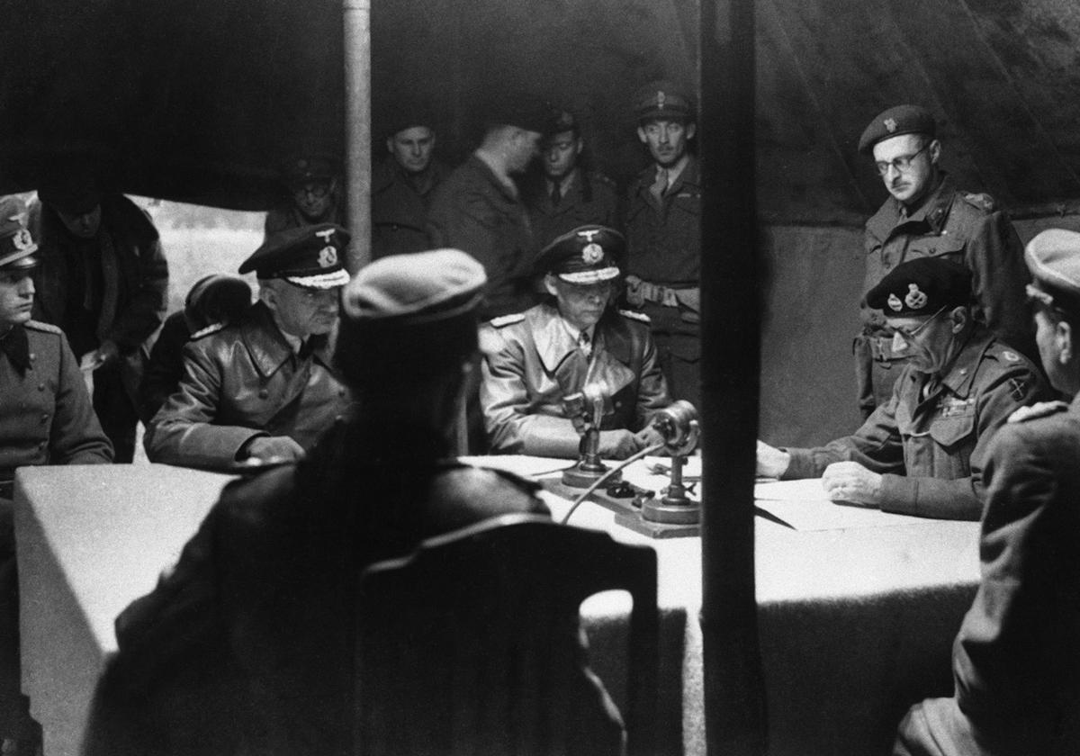 Montgomery reading surrender document to German officers at British 21st Army Group headquarters, Lüneburg Heath, Germany, 4 May 1945. This was only the large surrender in Germany of German forces facing British forces.