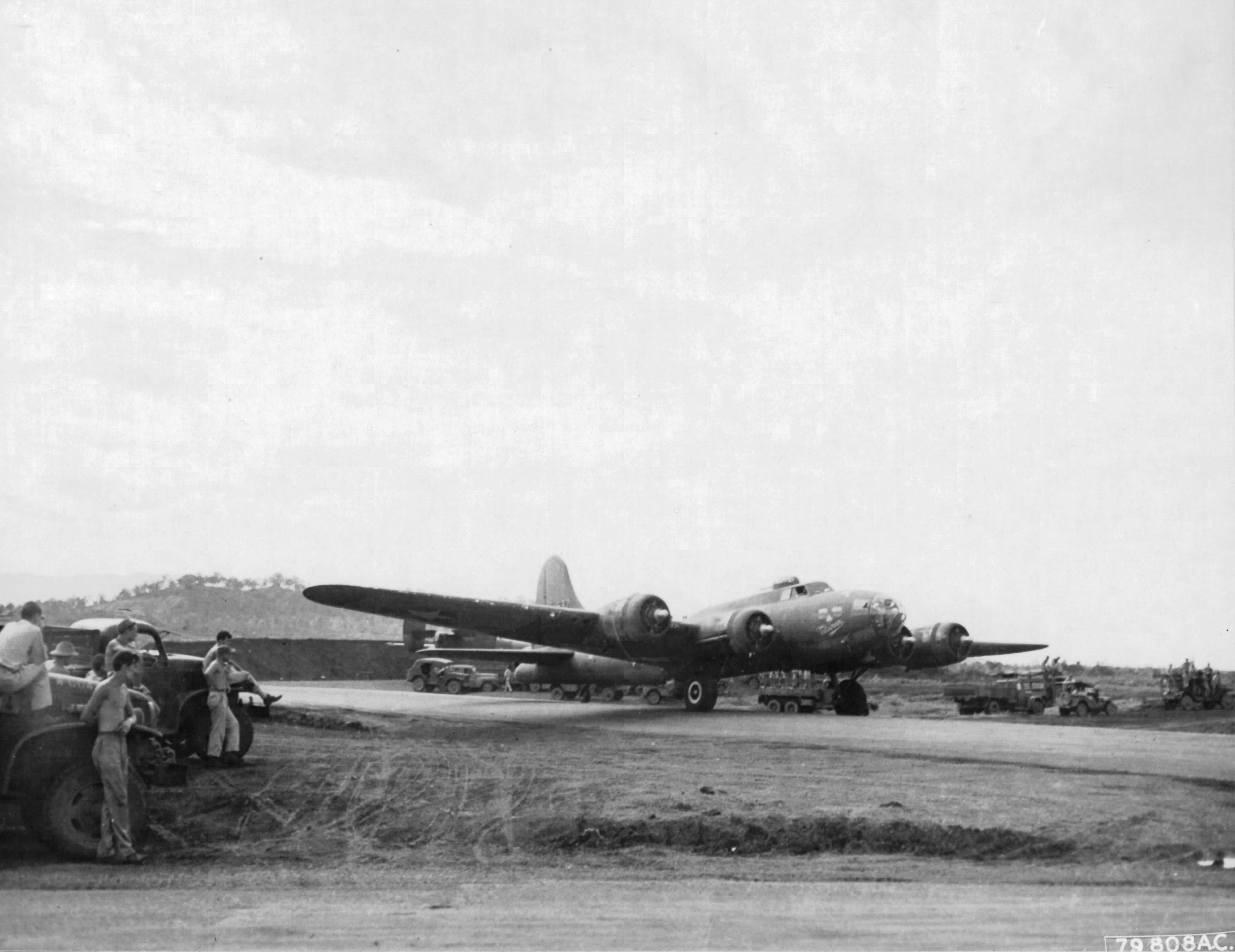 B-17F Fortress “Talisman” warming up before take-off from Jackson’s Drome, Port Moresby, New Guinea, 5 Sep 1943. This plane carried Douglas MacArthur to and from the battle zones in New Guinea.
