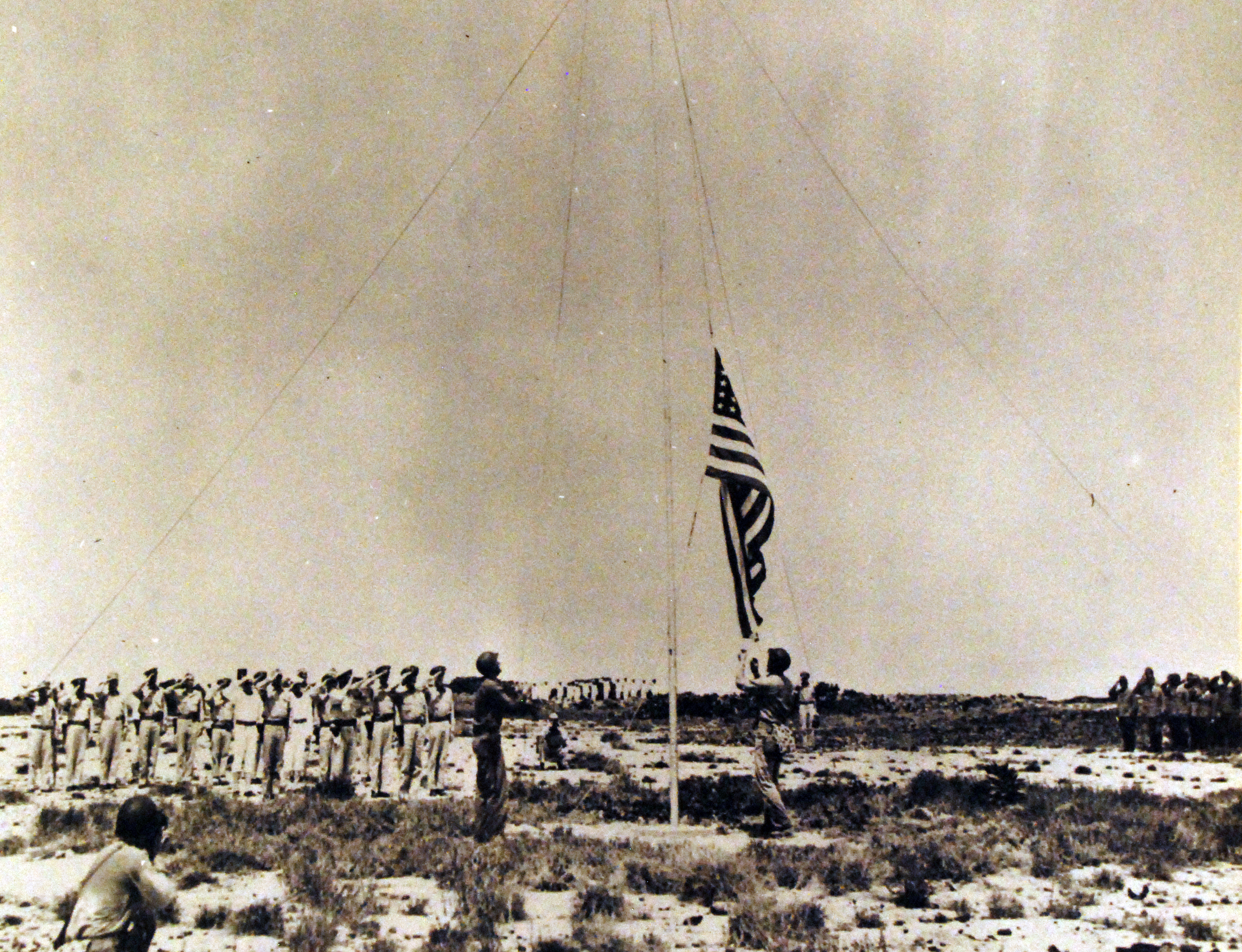 US flag raising, Mili, Marshall islands, Aug-Sep 1945; note Japanese officers at right of photograph