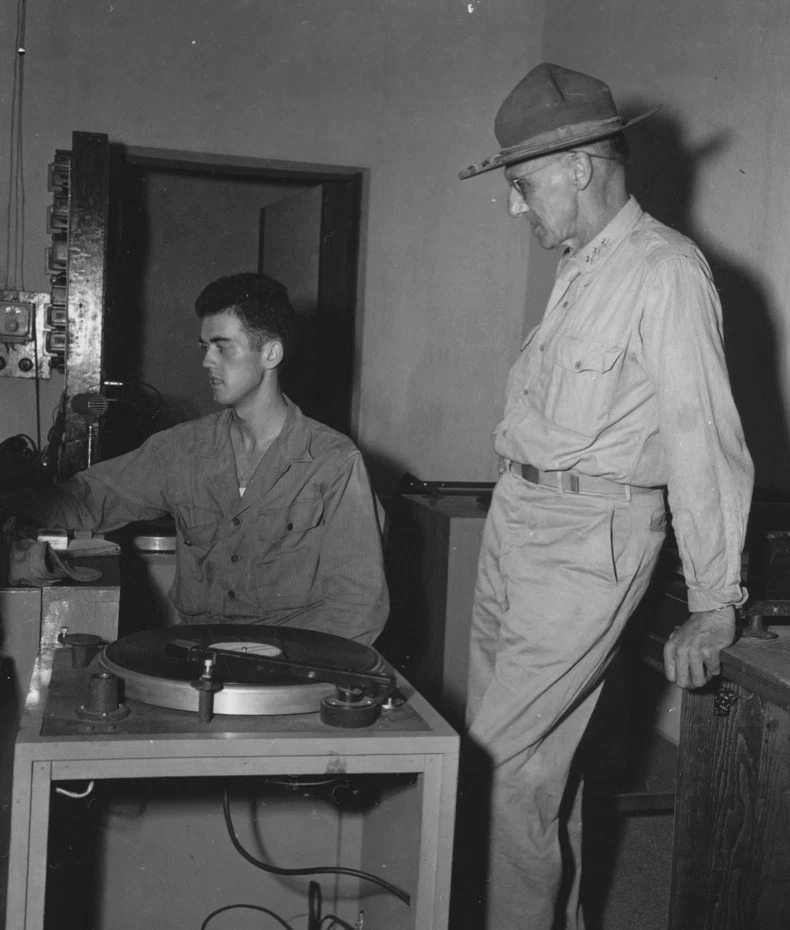 Lieutenant General Joseph Stilwell speaking to Coporal Jerry Givney at US Army radio station VU2Au, Calcutta, India, 30 Jul 1944