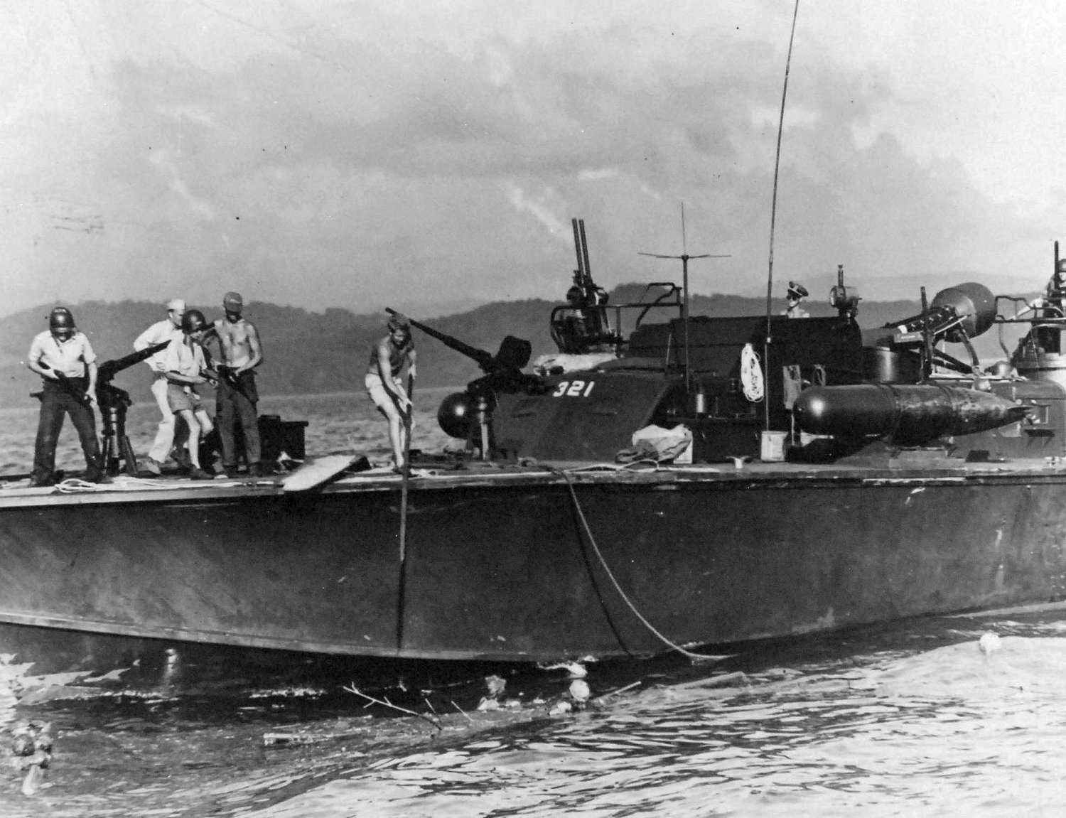 PT-321, an Elco 80-footer of Motor Torpedo Boat Squadron 21 (MTBRon 21), picking up Japanese survivors in Surigao Strait, Philippines, 25 Oct 1944