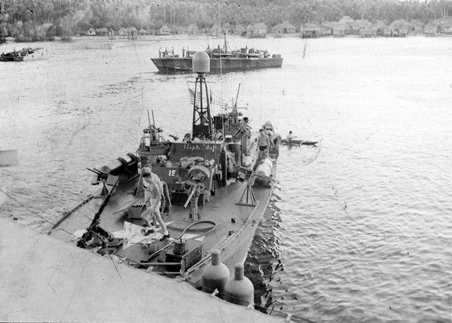 PT-196, an Elco 80-footer of Motor Torpedo Boat Squadron 12 (MTBRon 12) astern of PT Boat tender USS Wachapreague, Philippines, late 1944. Note the name “Purple Shaft” just below the windscreen.