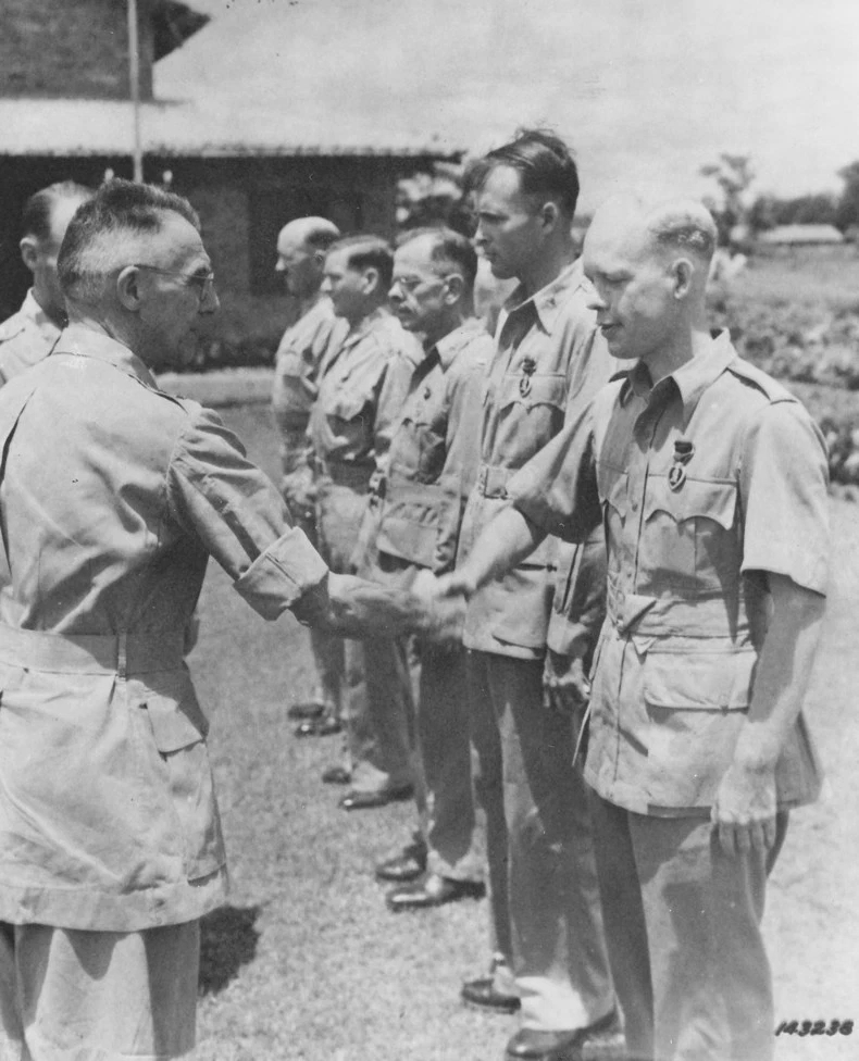 Lieutenant General Joseph Stilwell shaking hands with Captain John H. Grindley, who had just received a Purple Heart medal, India, mid-1942