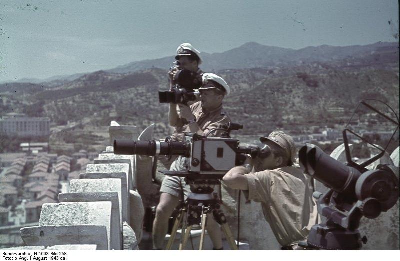 Horst Grund and other photo journalists atop a flak tower at the Strait of Messina, Italy, Aug 1943