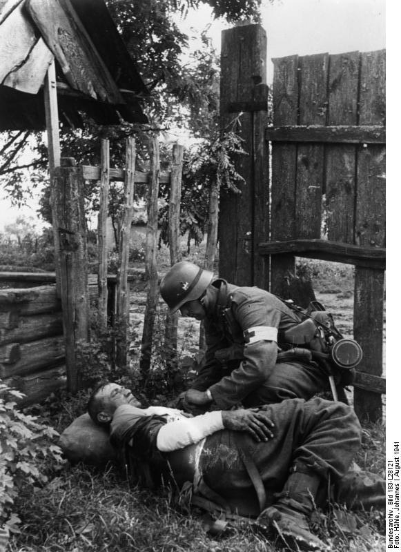 German medic treating a wounded soldier, Soviet Union, Aug 1941