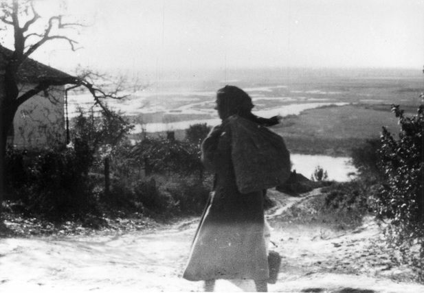 Jewish woman heading to the assembling point as dictated by the recently arrived Germans, Lubny, Ukraine, 16 Oct 1941