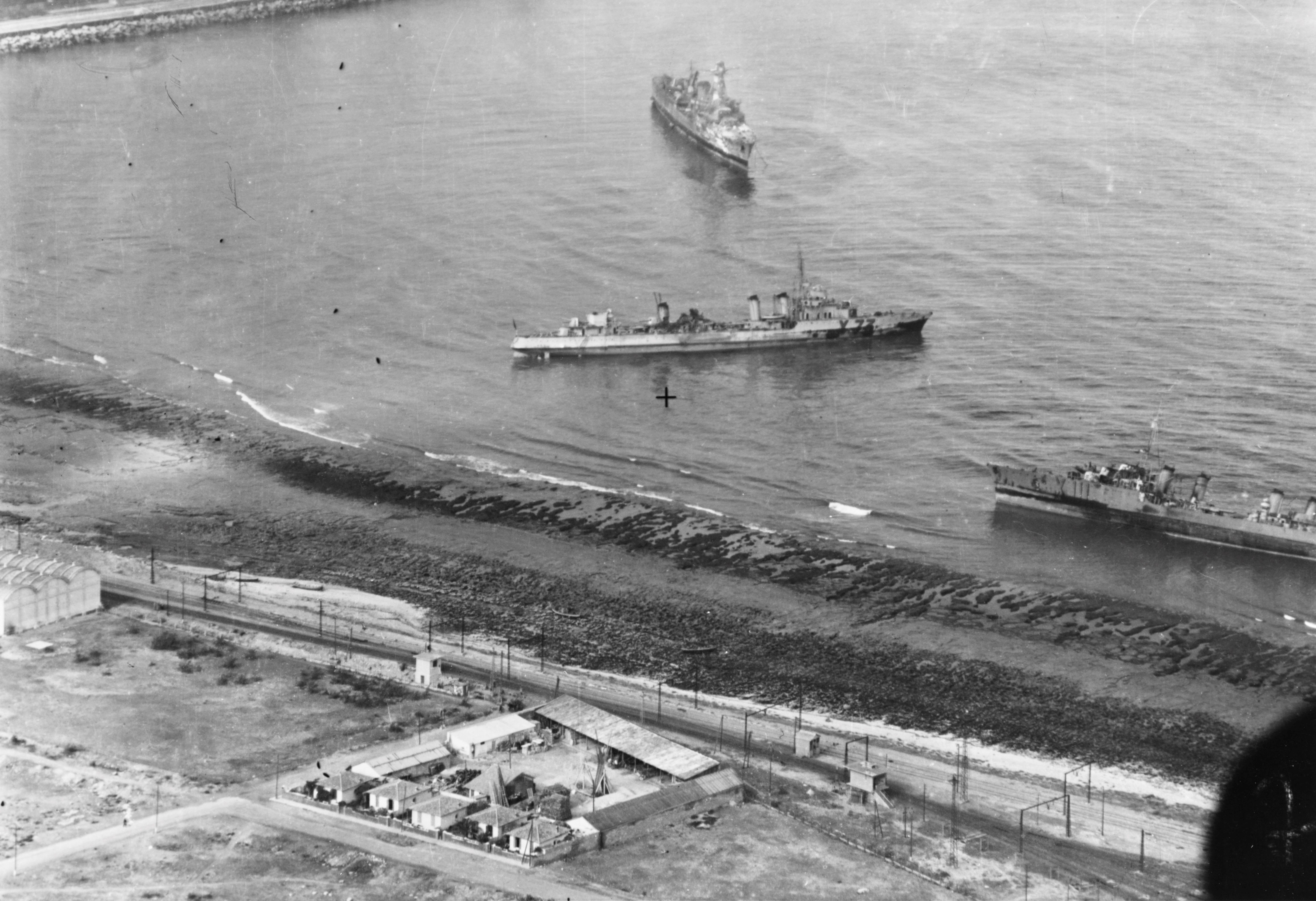 Aerial photograph from a USS Ranger plane showing three badly damaged French warships beached at Casablanca, French Morocco, 11 Nov 1942. They were damaged in the Battle of Casablanca 8 Nov 1942