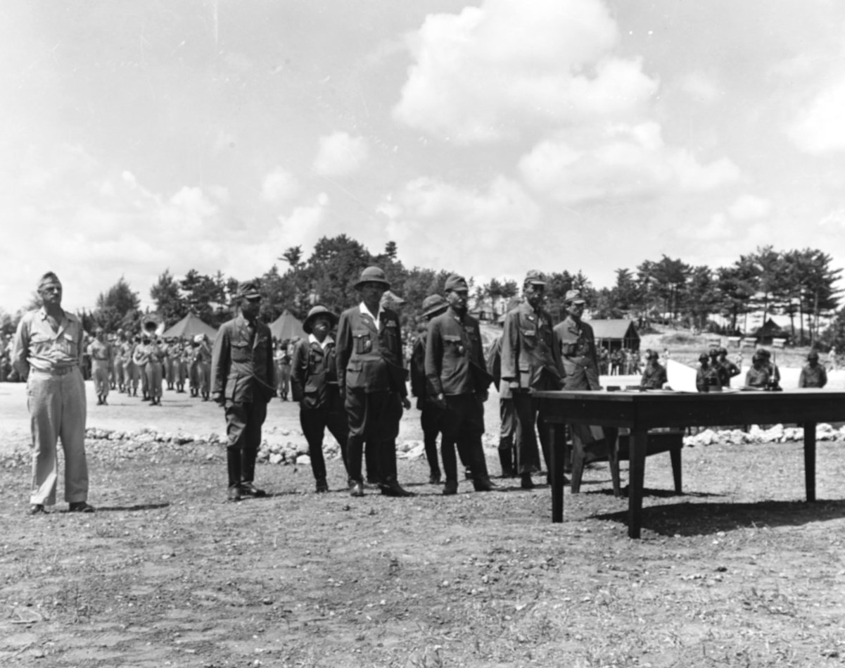Lt General Toshiro Nomi (in pith helmet) at US 10th Army headquarters to formally surrender all Japanese forces in the Ryukyu Islands to US Lt General Joseph Stillwell, Yontan, Okinawa, Japan, 7 Sep 1945