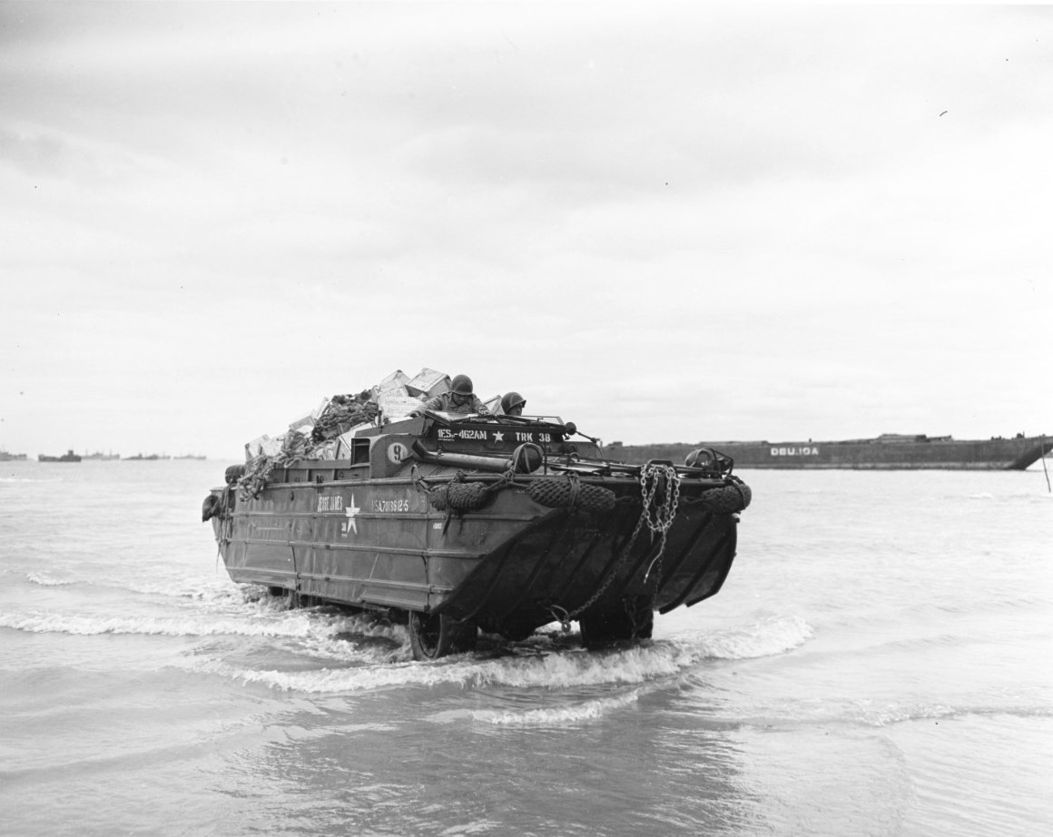 A fully loaded DUKW coming ashore at Normandy, France, 11 Jun 1944.