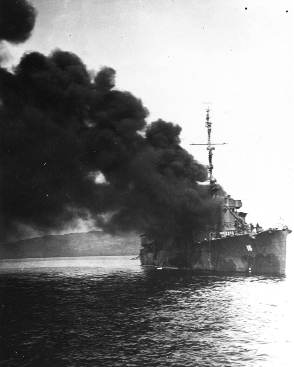 USS Ward on fire and sinking after being struck by a Japanese special attack aircraft in Ormoc Bay, Philippines, 7 Dec 1944, three years to the day after she fired the first US shot of the Pacific War.